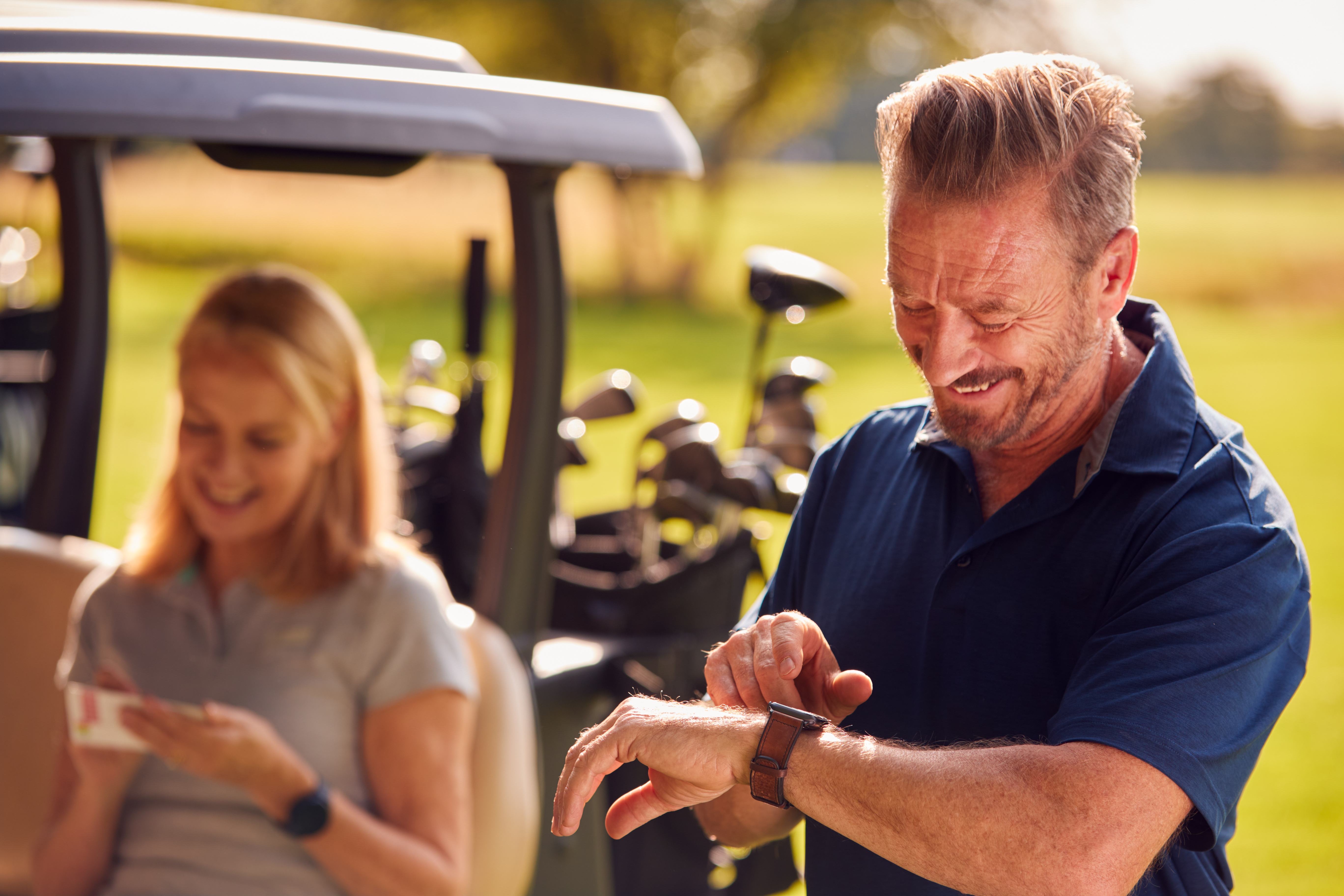 A dad uses the watch he received as a Father’s Day gift from his kids.