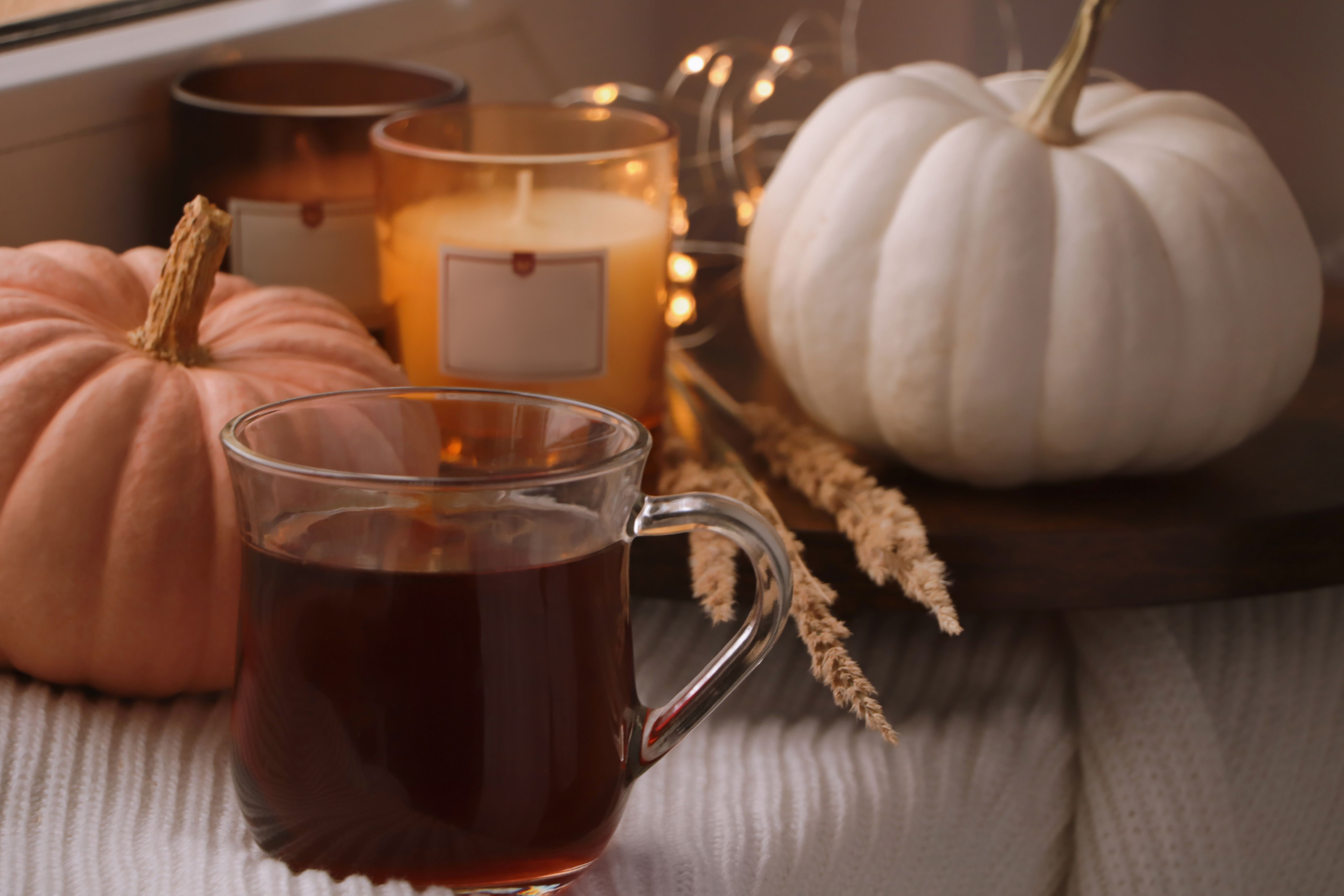 Autumn-scented candles make the house extra cozy for Thanksgiving guests.