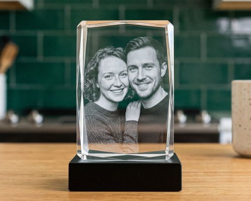 ArtPix 3D vs 3D Crystal: an ArtPix 3D photo crystal rectangle on a black LED base on a walnut desk