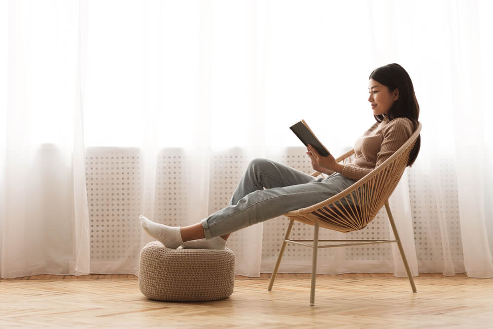 A woman looks through a book on home decor she received for her birthday.