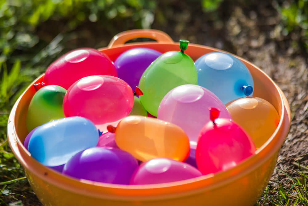 Fun outdoor activities to celebrate the last days of summer include a water balloon fight!