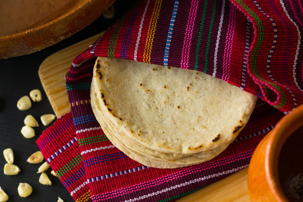 Warm, homemade tortillas are ready to be served at a housewarming party.