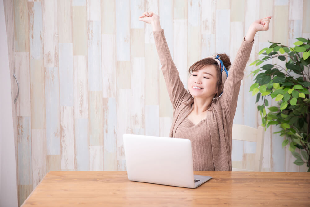 A Cancer woman wears a comfy set of loungewear while working from home.