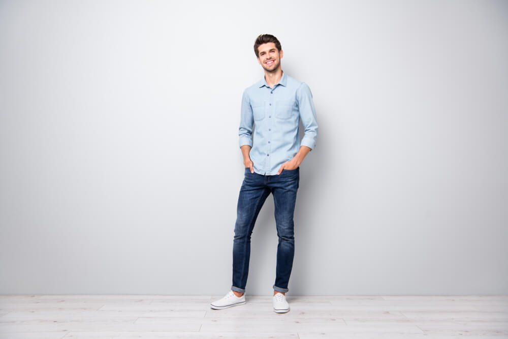 A young dad shows off his new pair of jeans. 