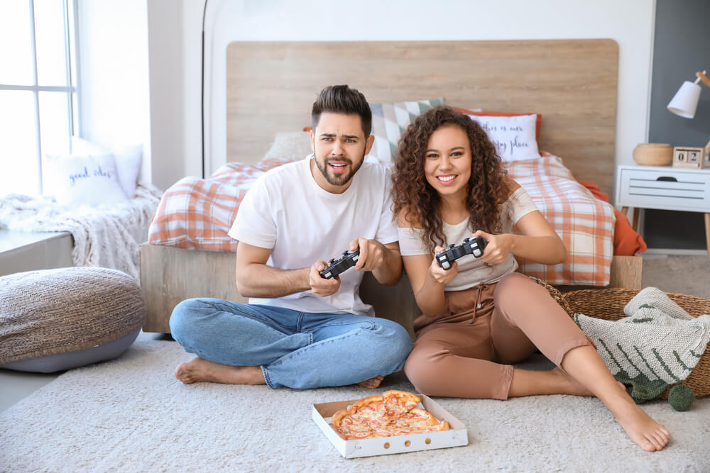 An unconventional couple spends their anniversary playing video games together.