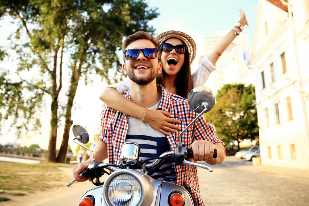 A fun-loving couple in their thirties takes an exciting motorcycle ride.