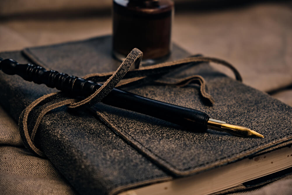 A leatherbound guestbook for a Halloween-themed baby shower.