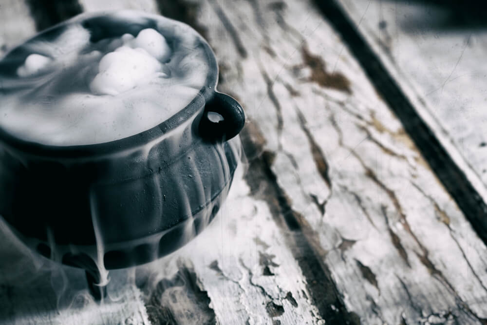 Dry ice makes the punch bowl at a Halloween event look extra spooky. 