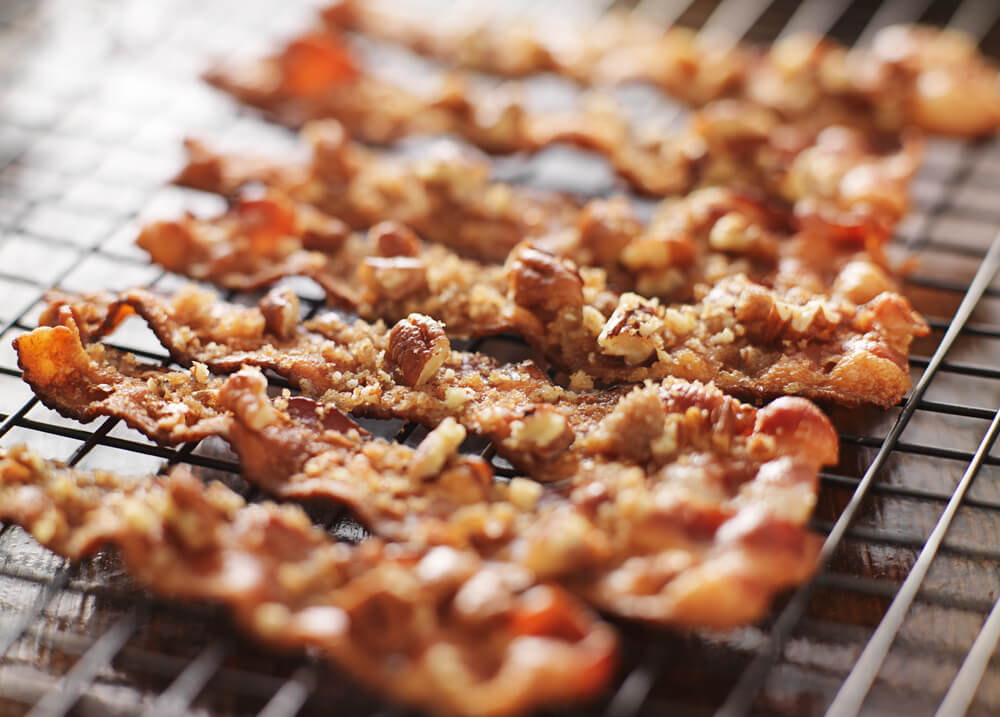 A tray of crispy, candied bacon strips made with love at home. 