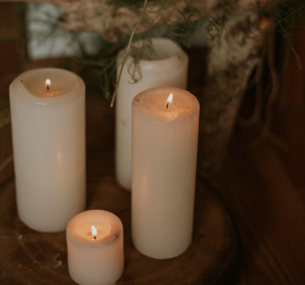 Handmade candles brighten up a dark room on a cold night.