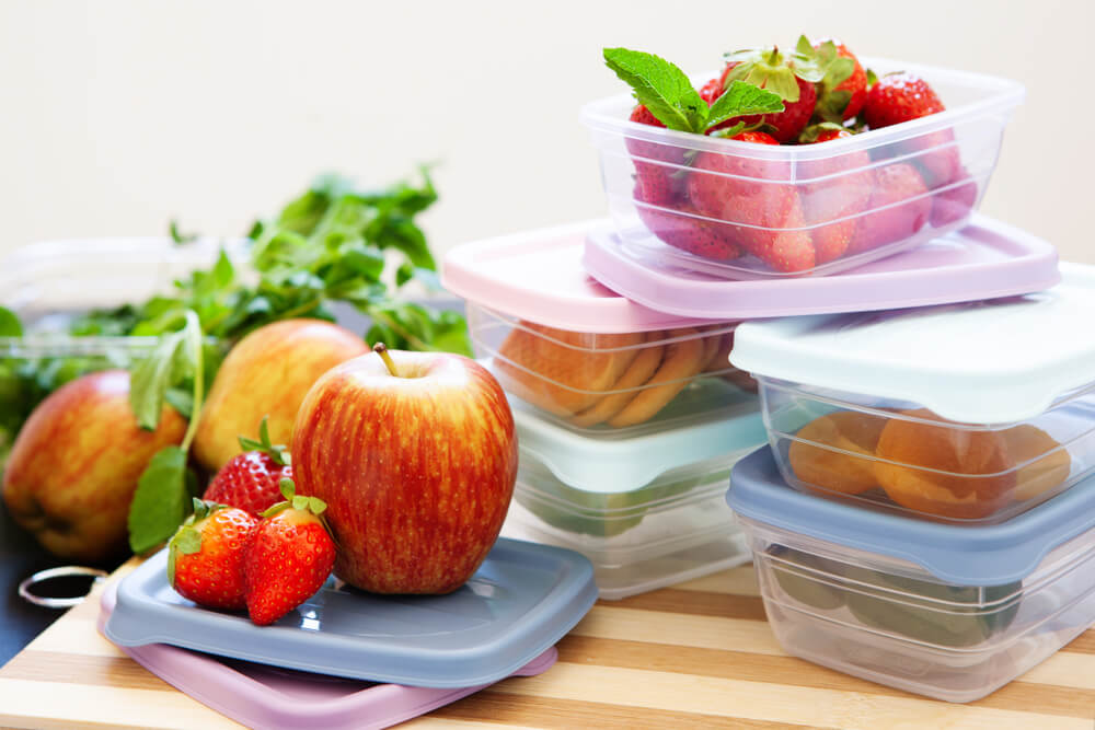 Fresh fruits and vegetables are stored in reusable containers.