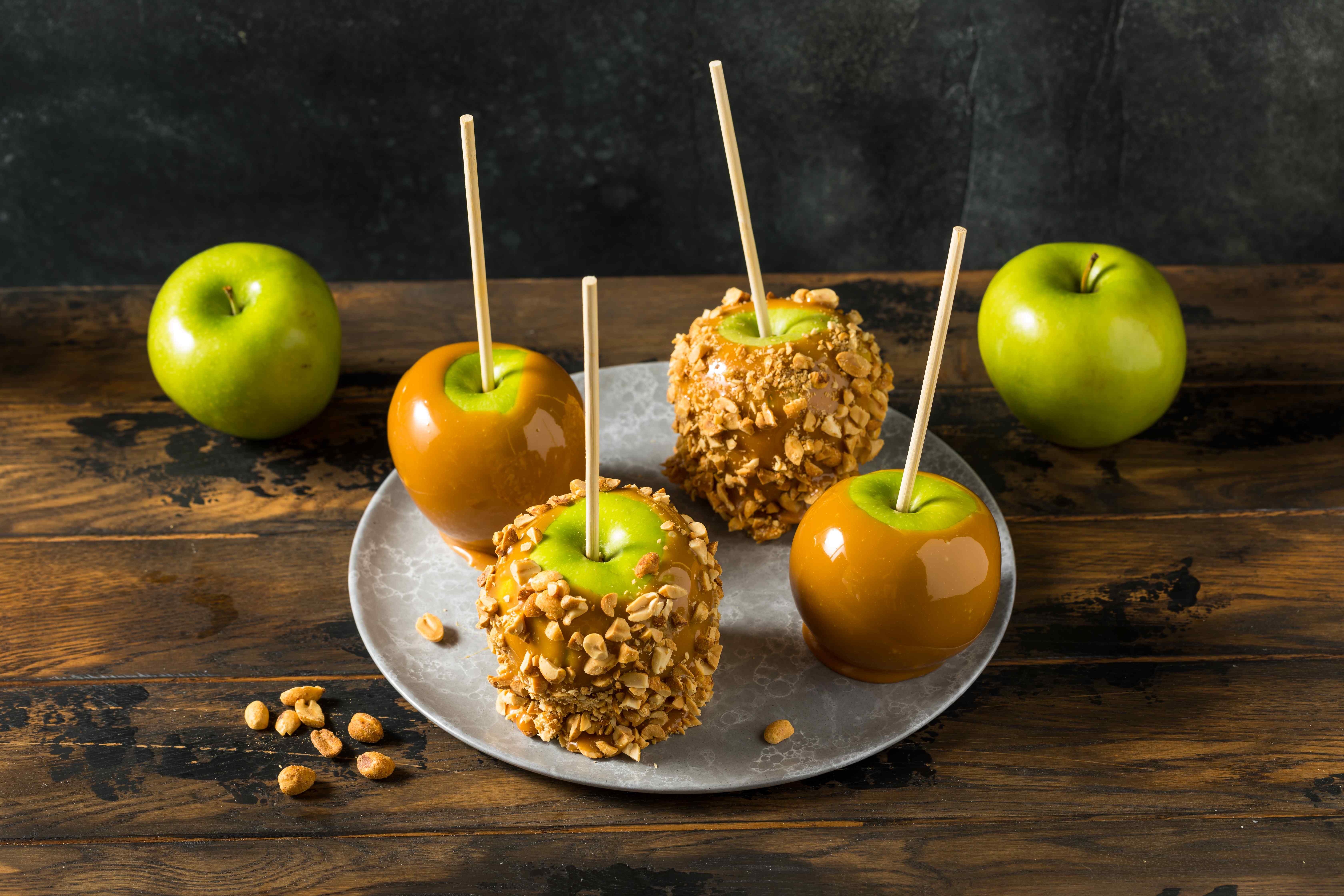 Freshly-dipped caramel apples for a family-friendly Halloween party at home
