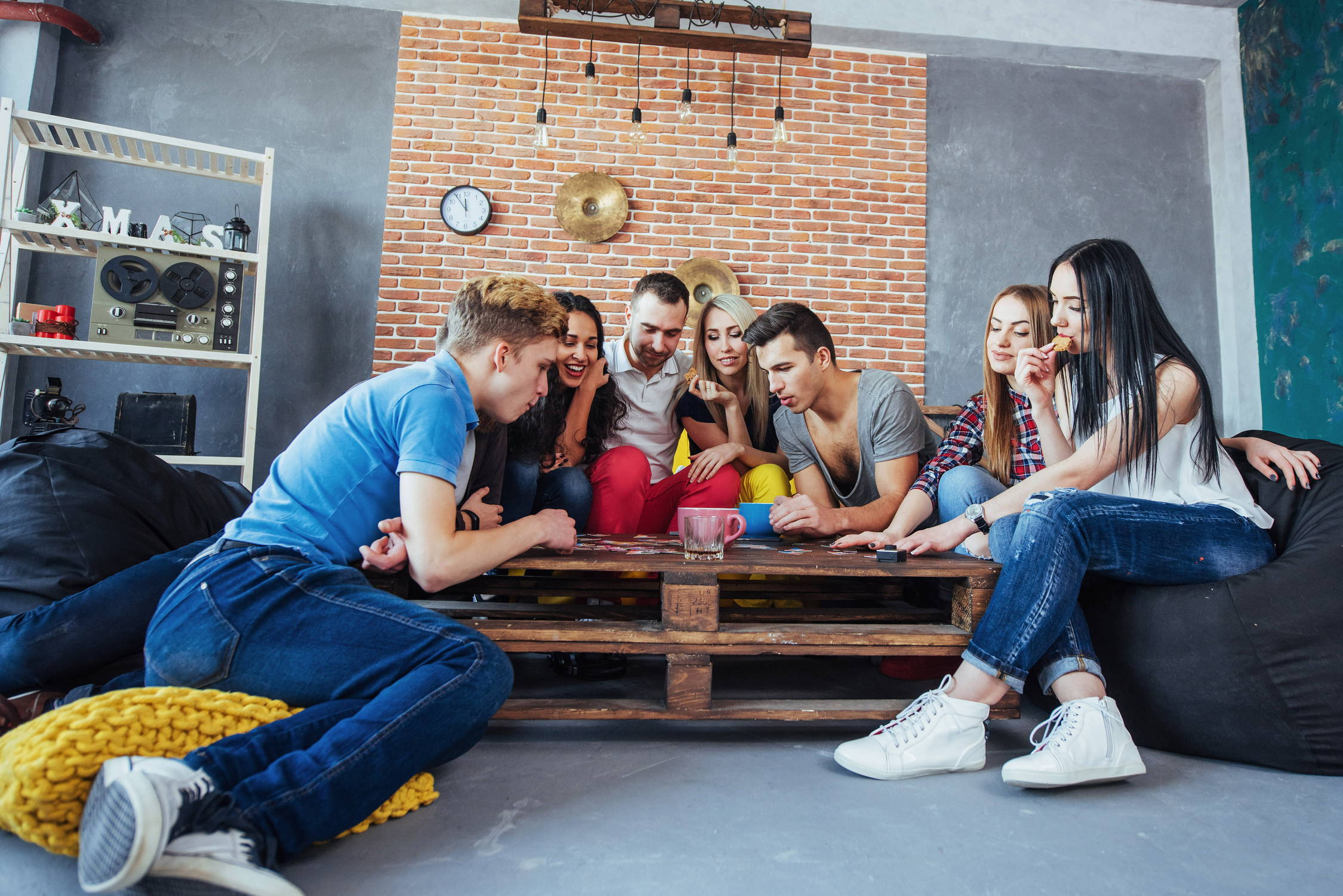 A group of friends learn to play a new board game together.