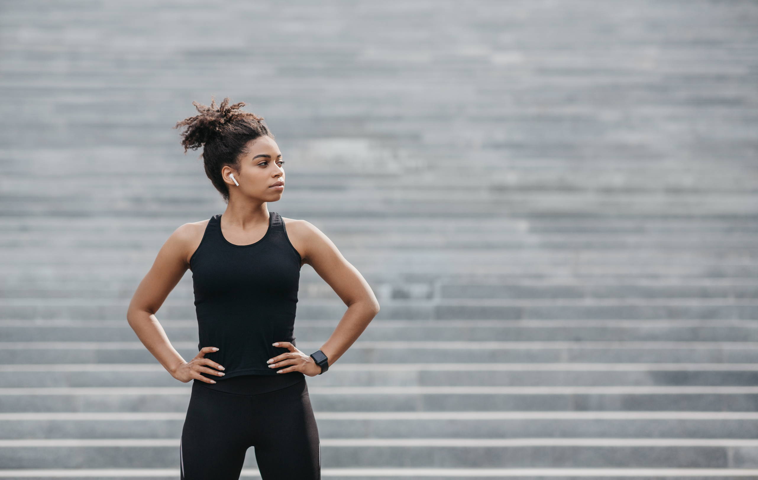 A fit woman wears her stylish new workout clothes on her daily jog.