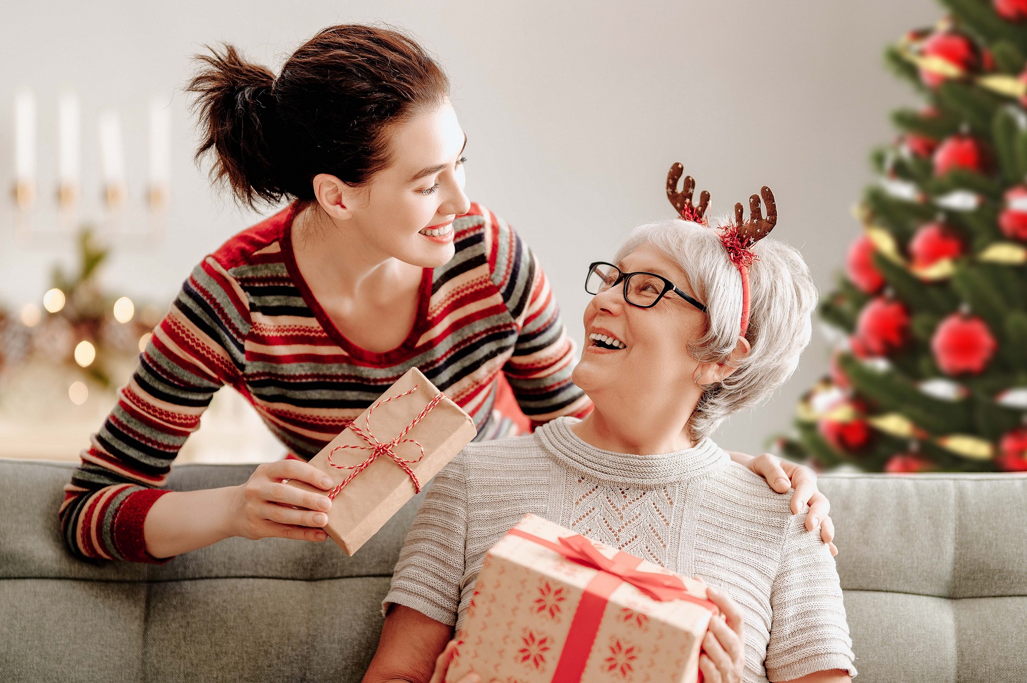 A loving daughter surprises her mom with a Christmas gift. 