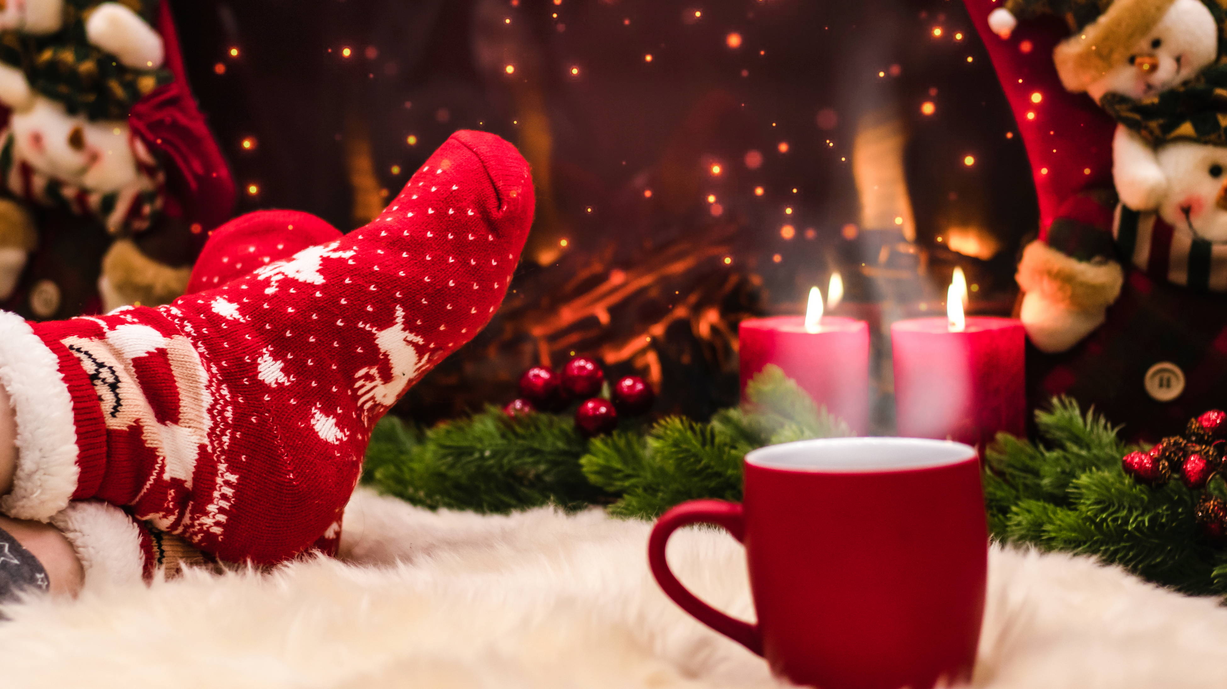 A woman enjoys the holiday socks she got from her Secret Santa for Christmas.