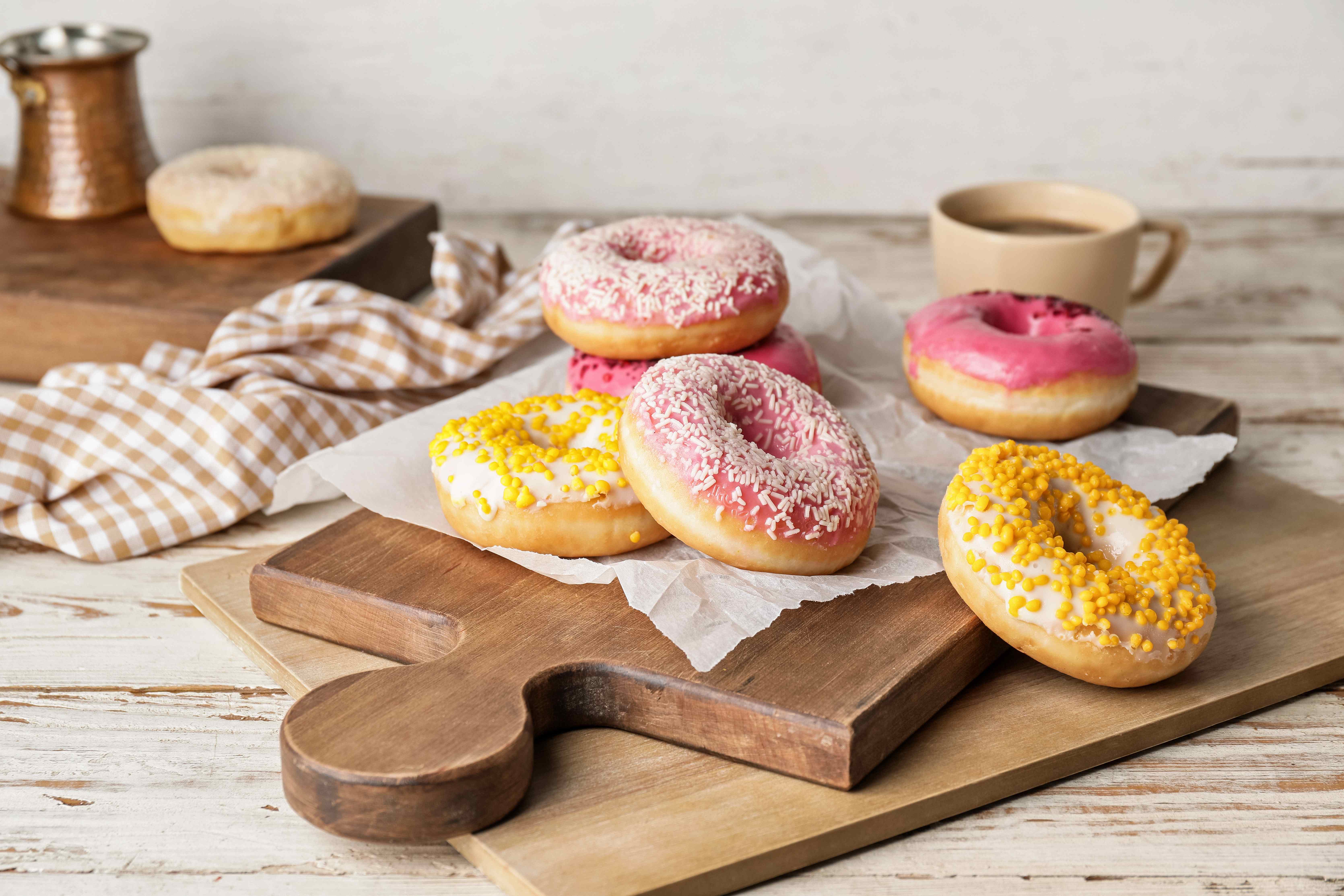Donuts with sprinkles on a charcuterie board for dessert. 