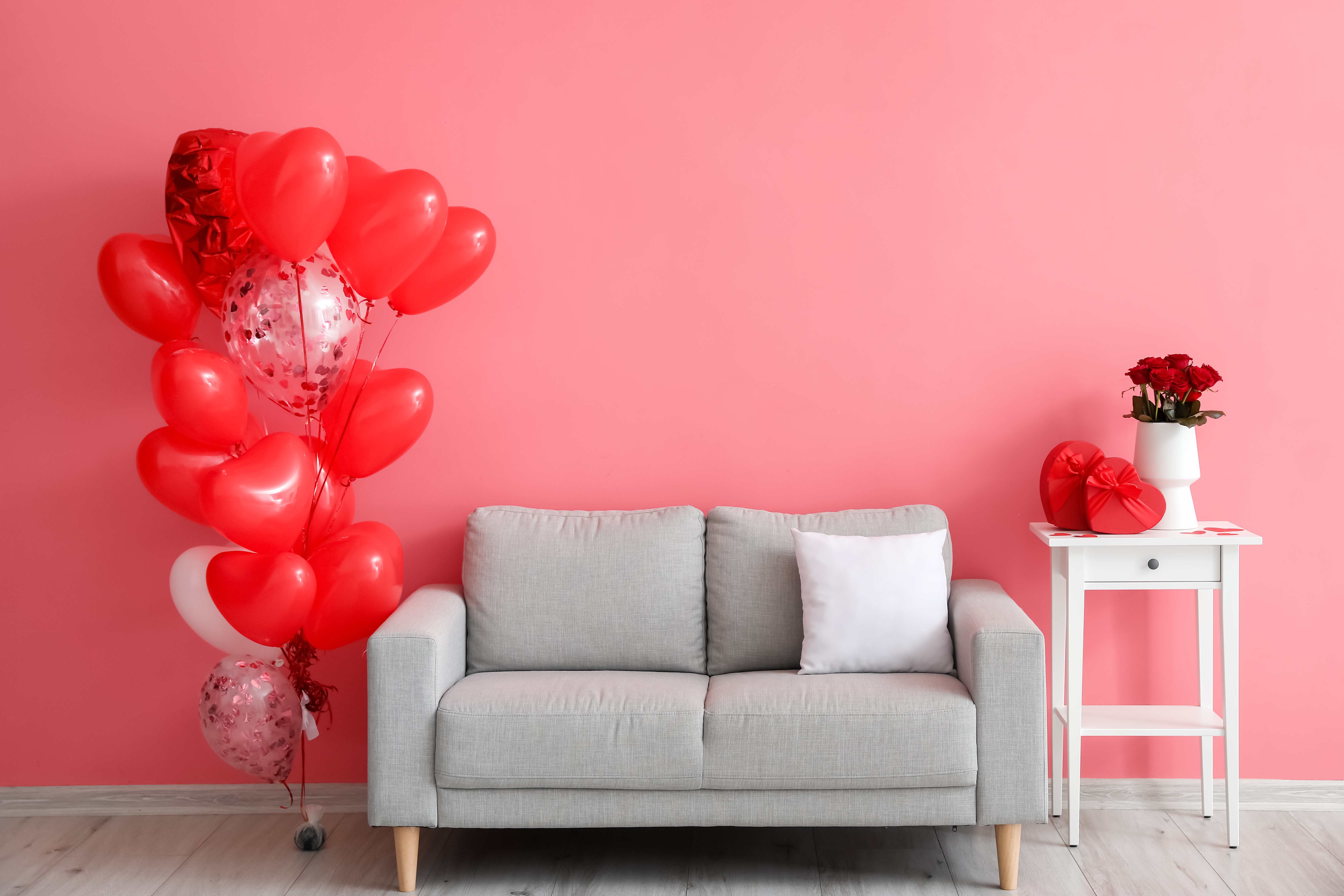 A pink living room is beautifully decorated for Valentine’s Day.