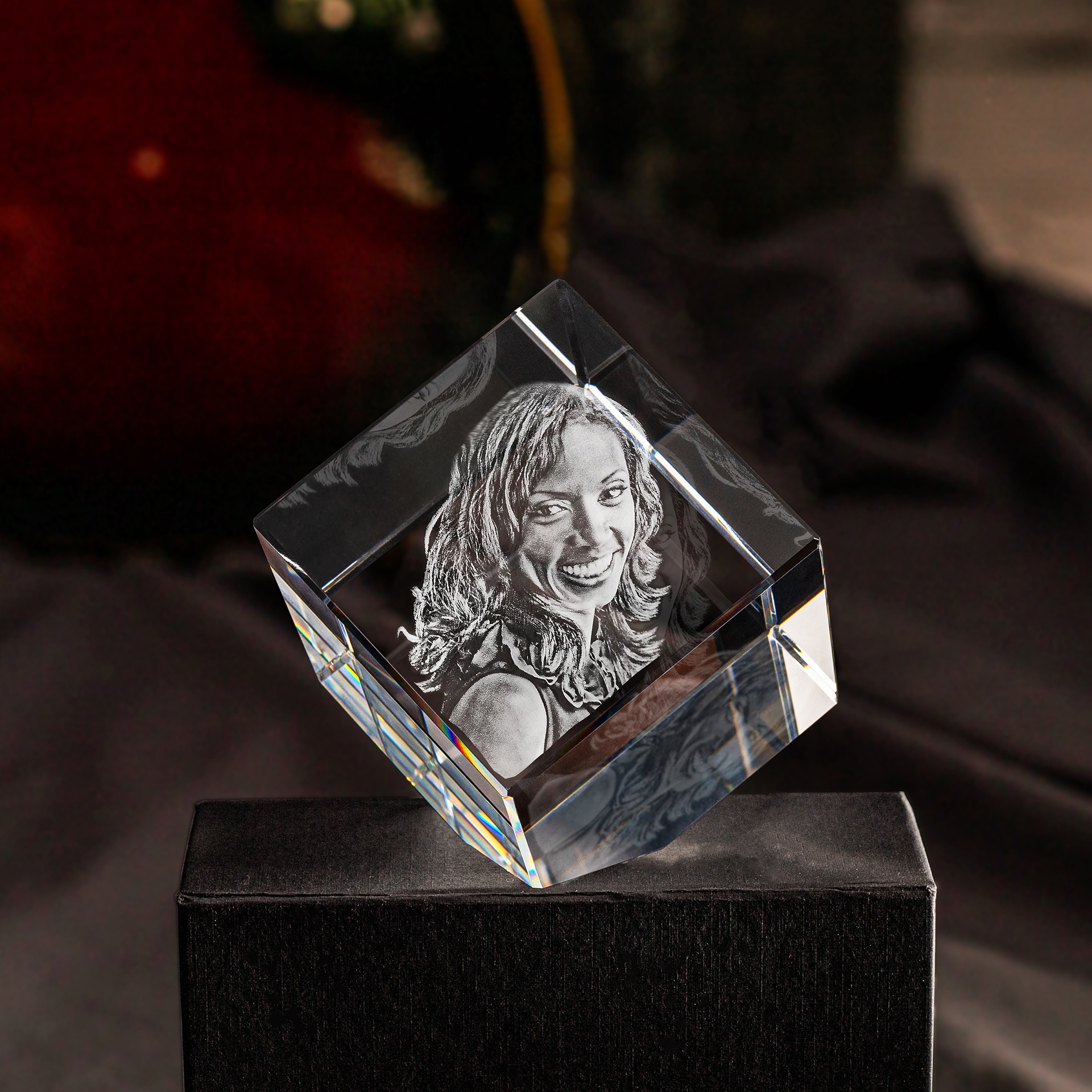 A personalized ArtPix 3D Photo Crystal with a picture of a confident woman engraved inside.