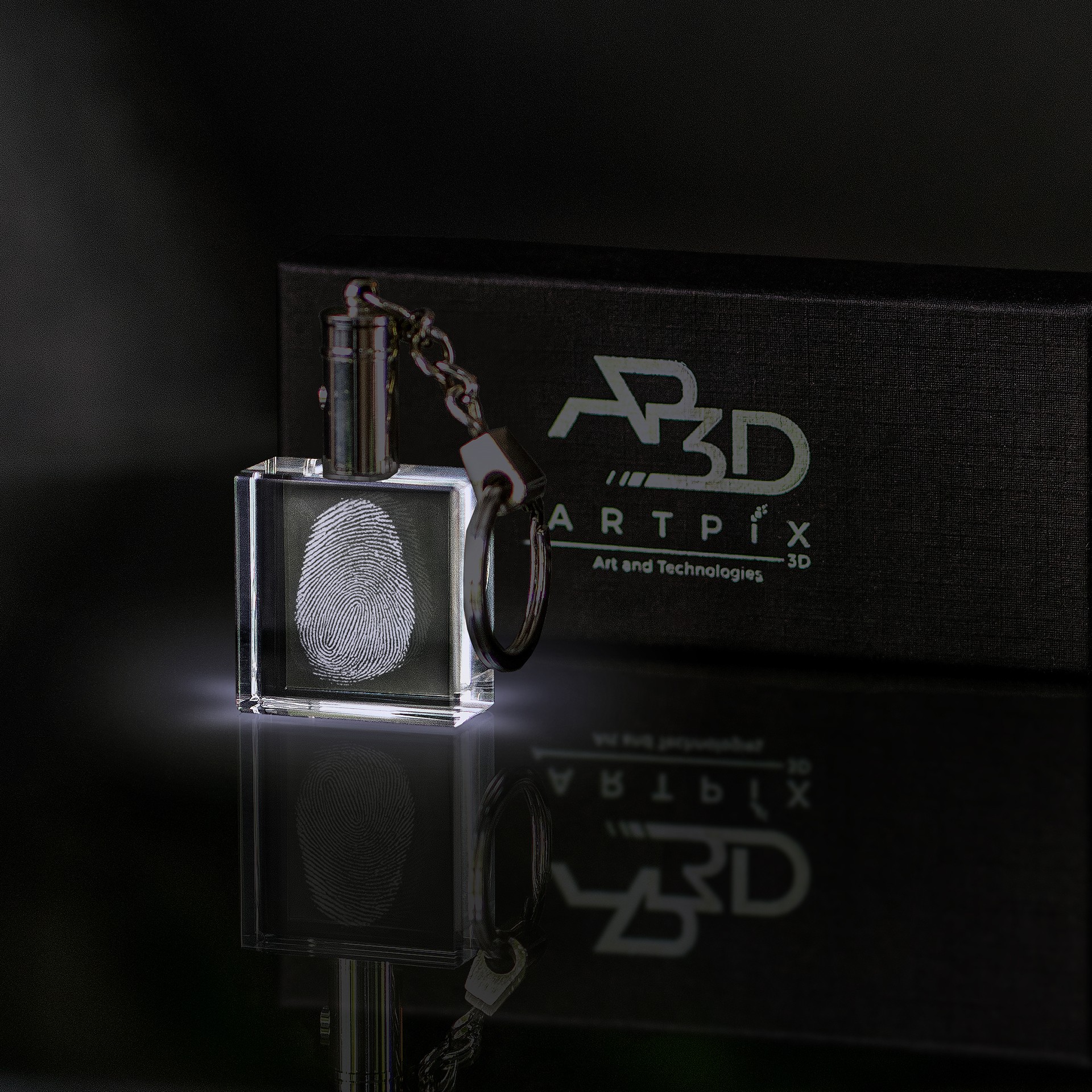 A crystal keychain with an LED light and a personalized fingerprint engraving. 