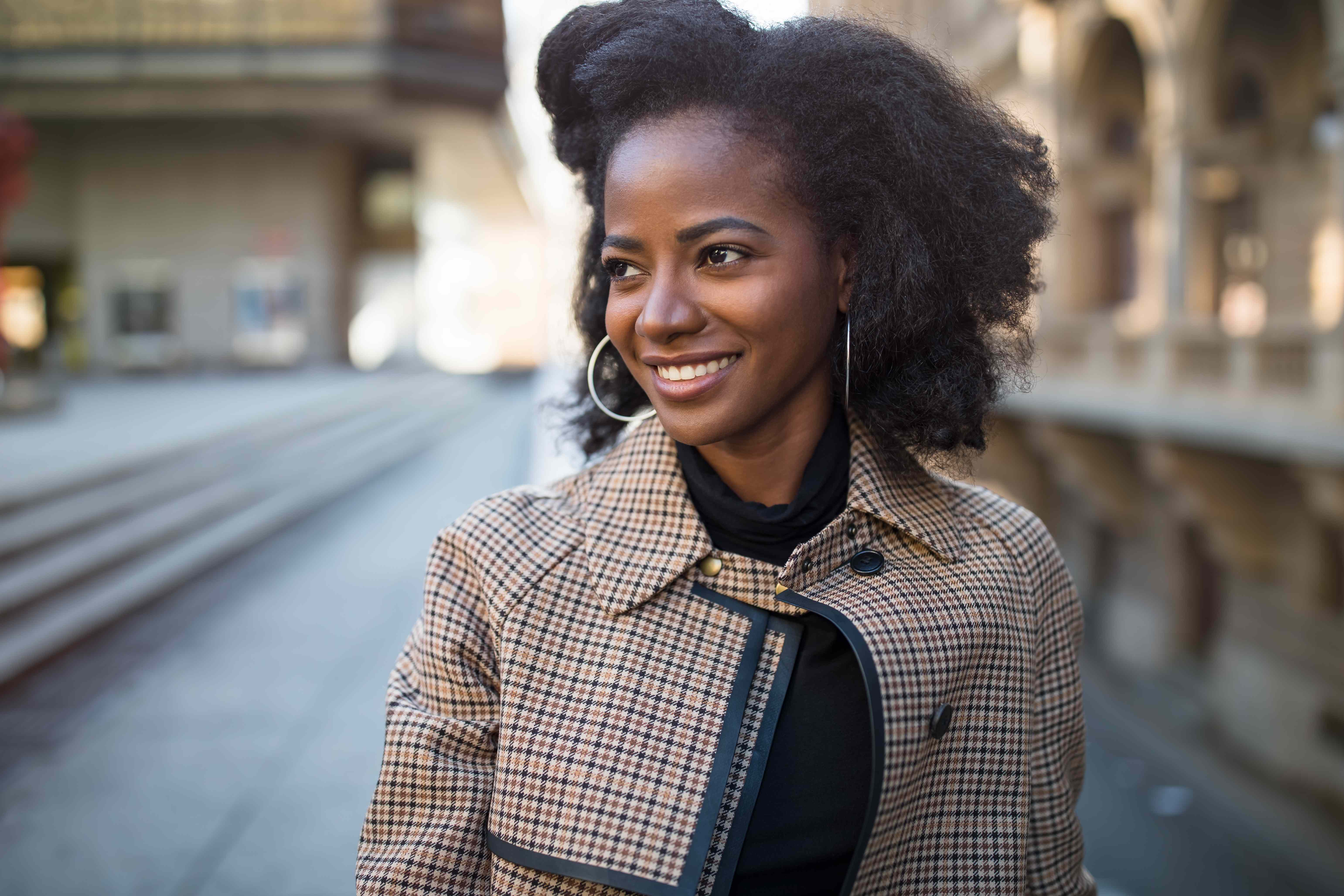 A stylish woman shows off her new hoop earrings. 