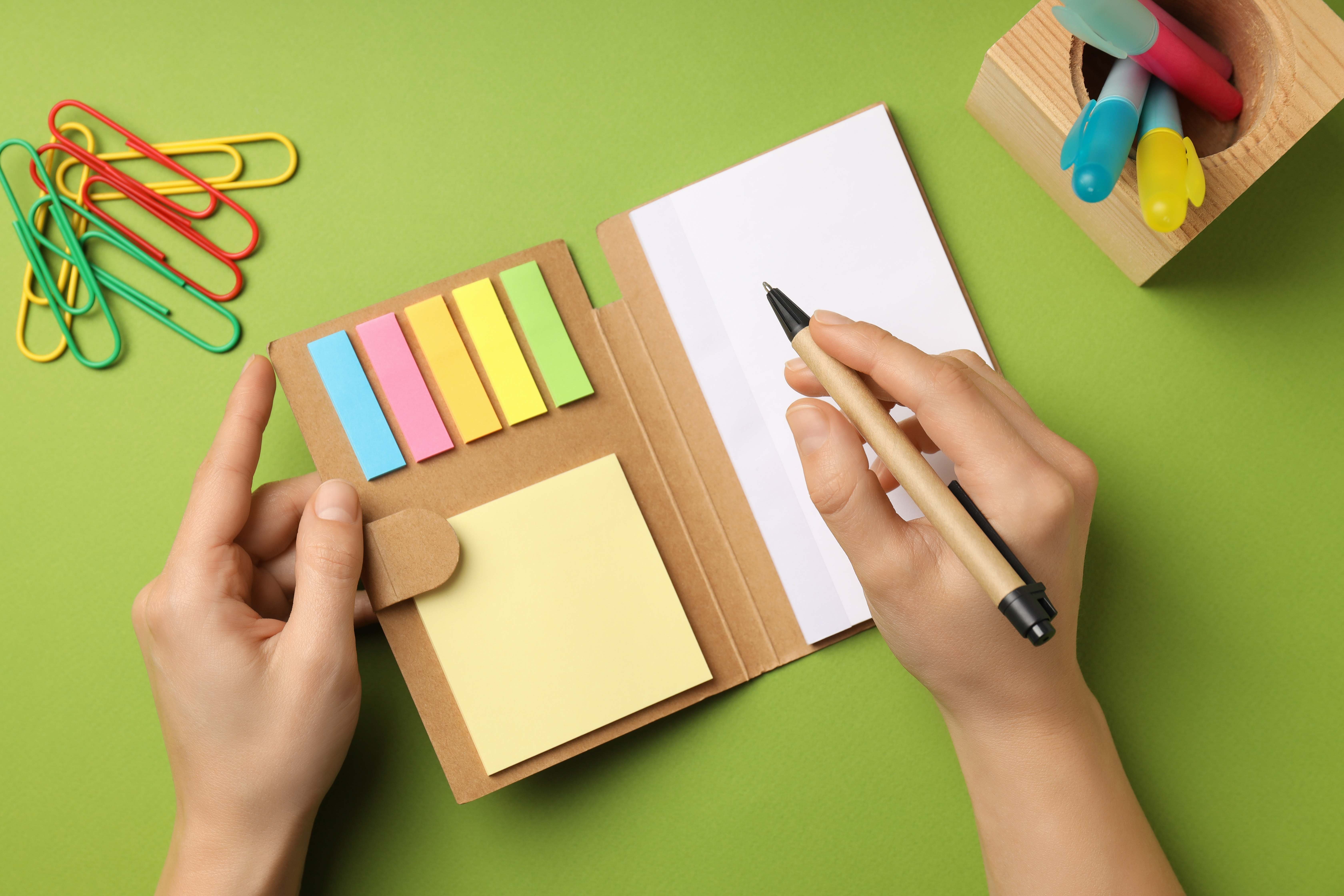 A woman uses the cute stationery set she received as a birthday gift. 