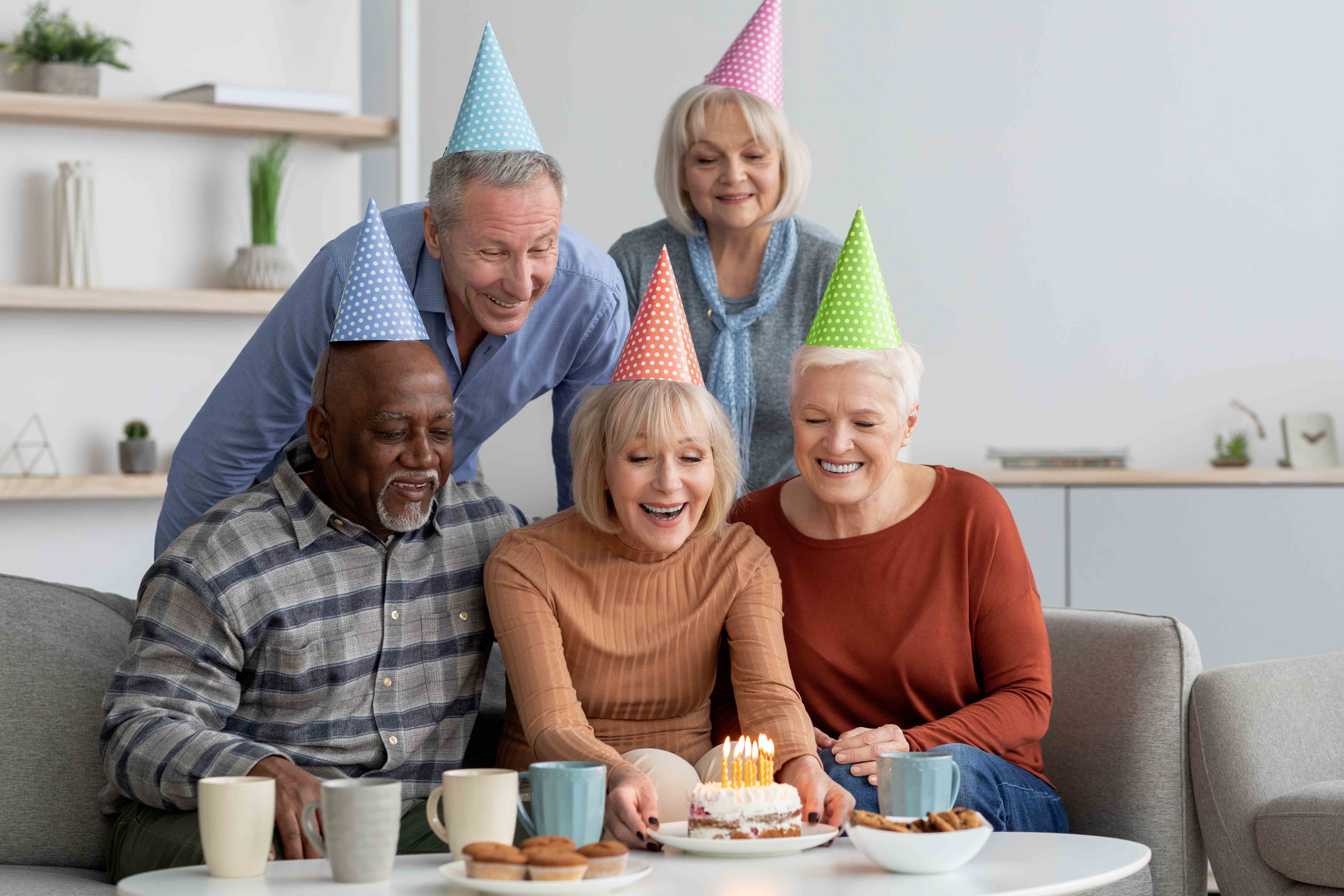 A happy group of seniors celebrate their coworker’s retirement.