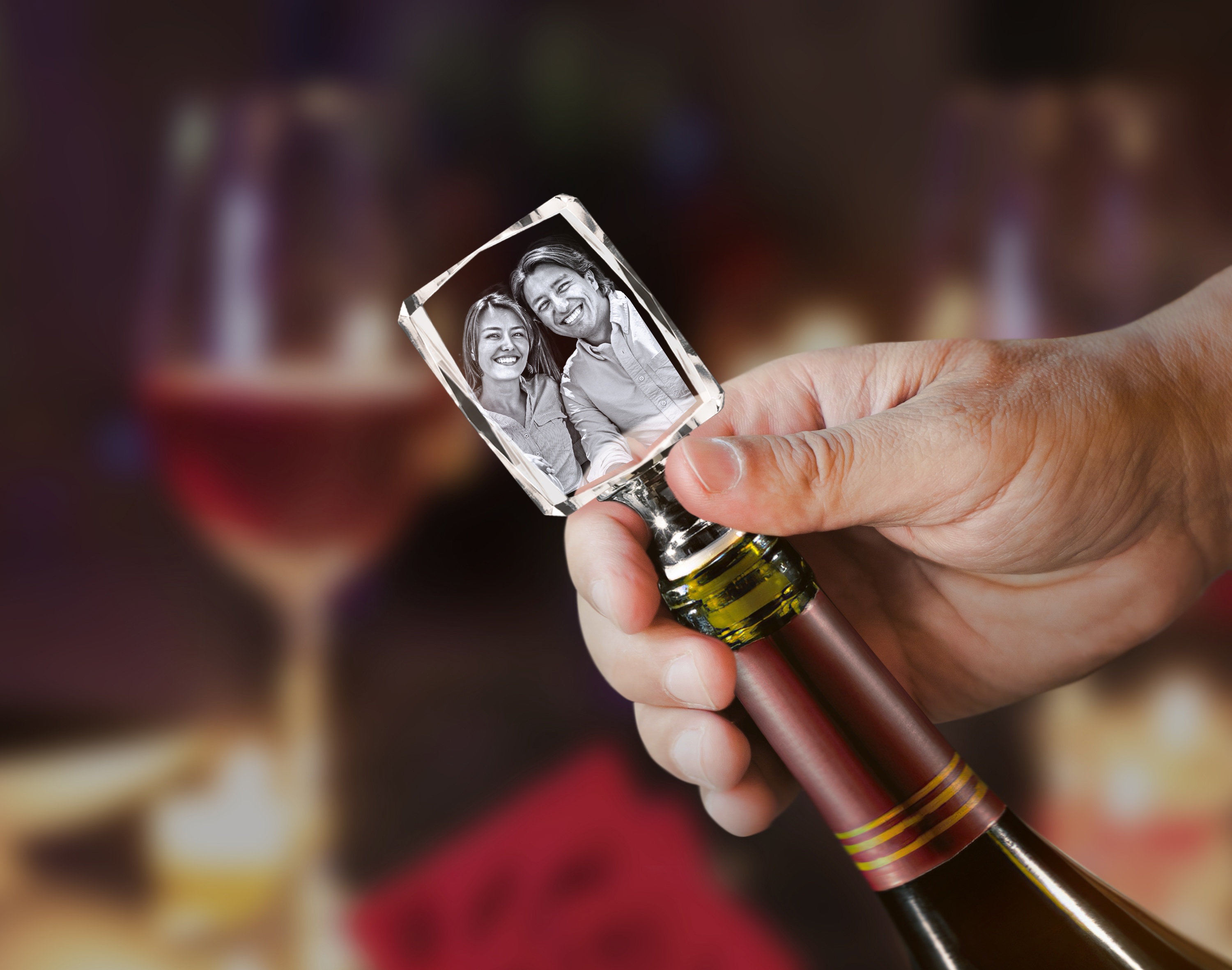 A beautiful photo of a sweet couple is engraved inside a crystal wine stopper.