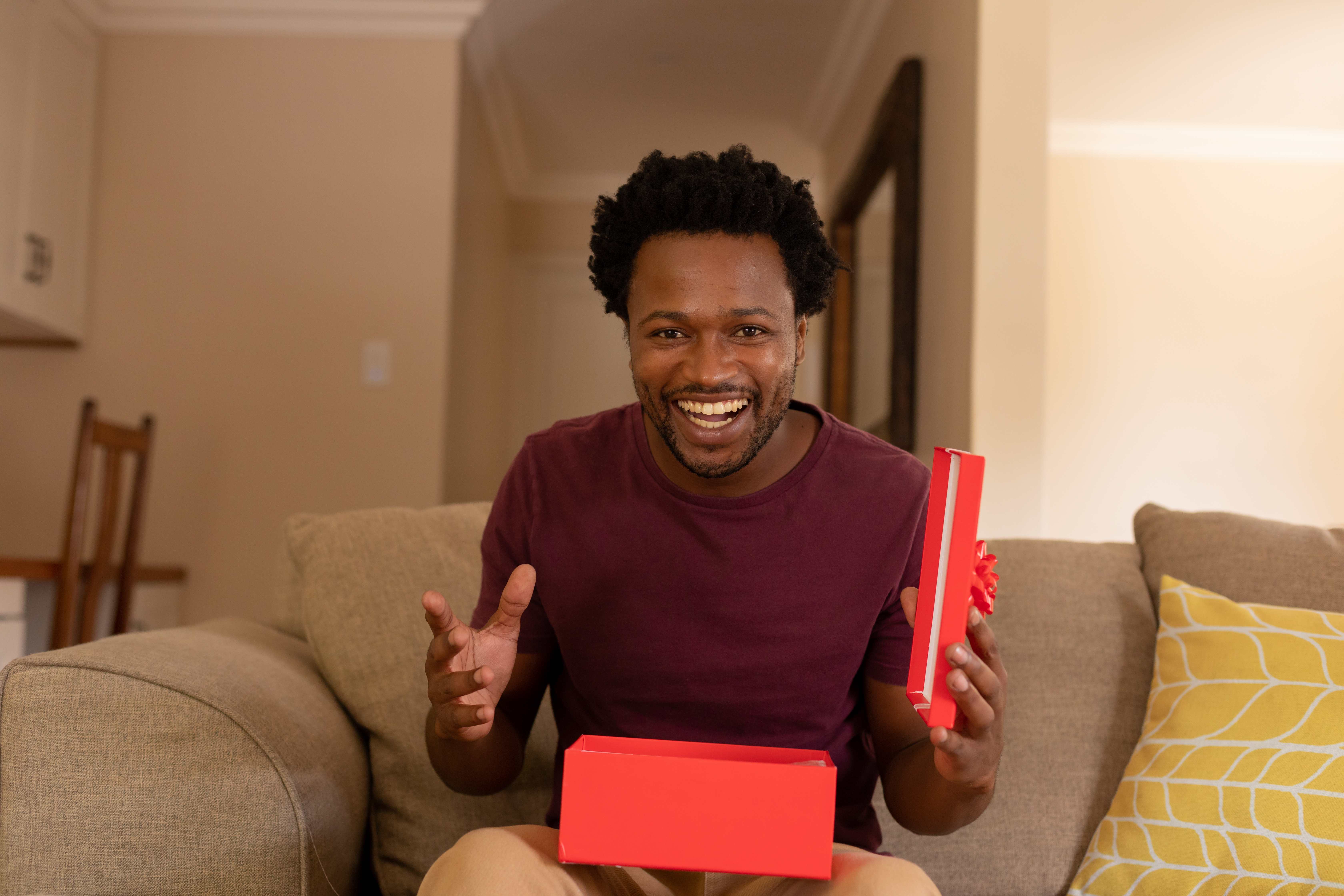 A happy Pisces man receives a care package for his birthday. 