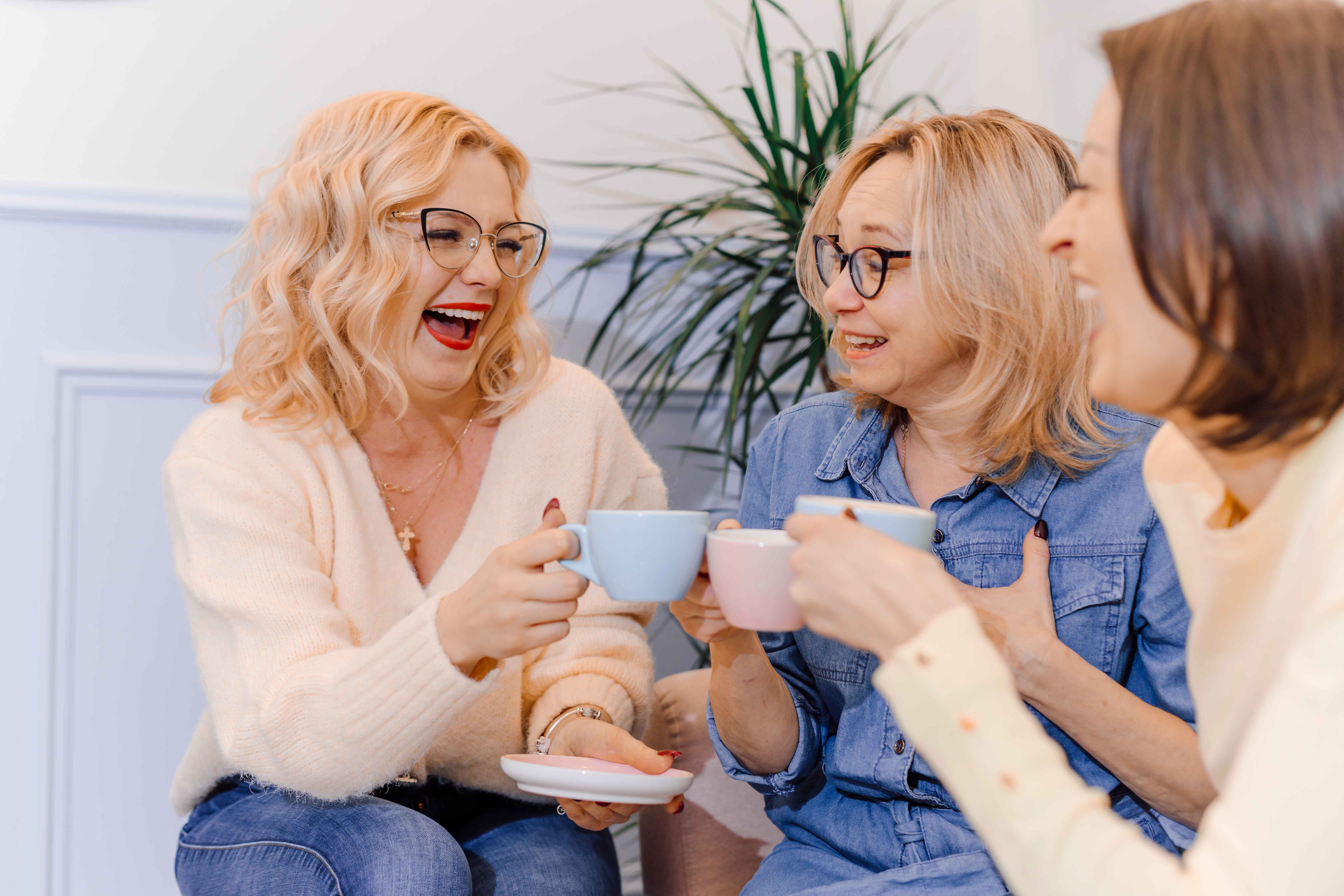 Three women enjoying coffee together at the family Easter brunch.