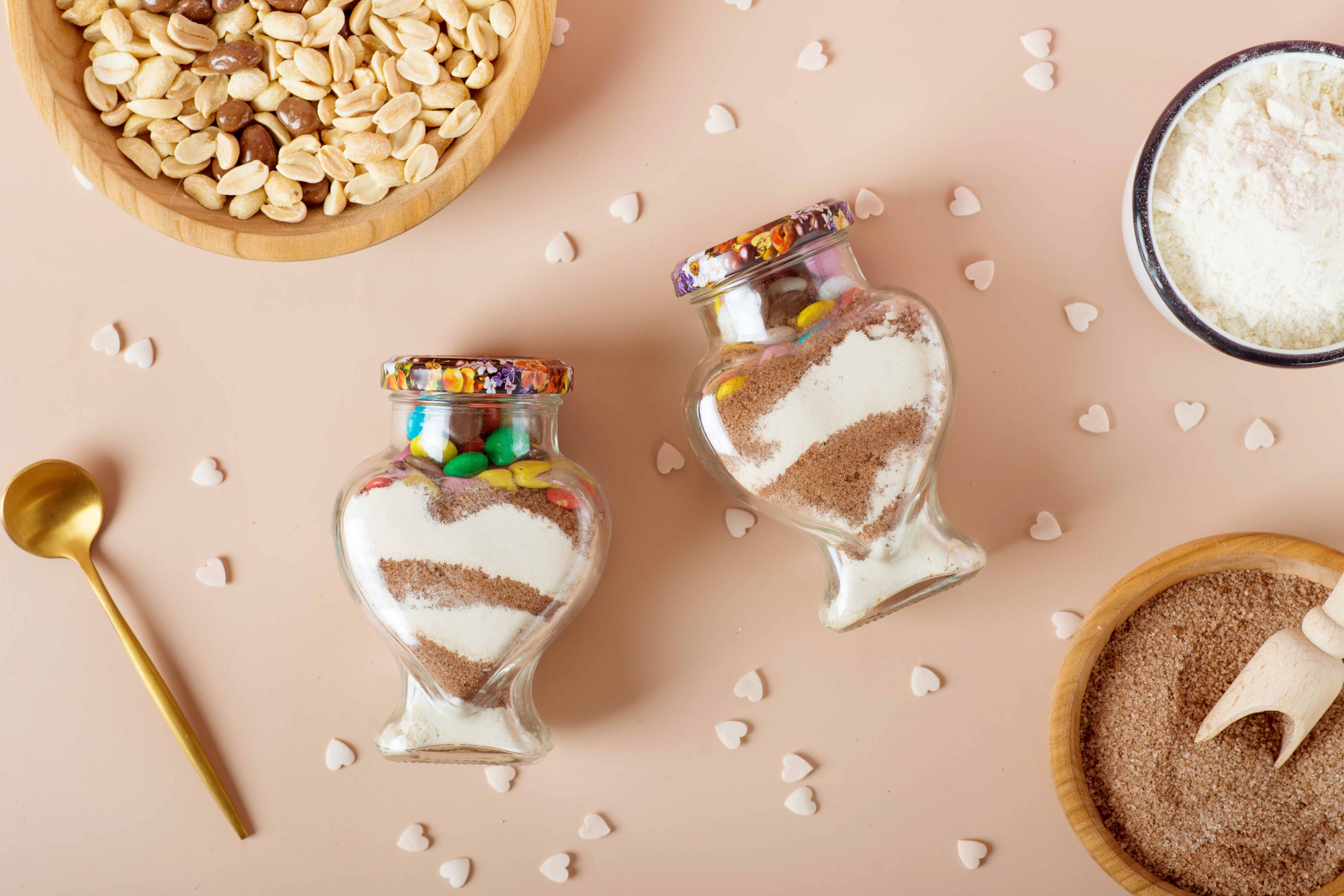 Dry ingredients for a delicious cookie recipe are assembled in giftable jars.