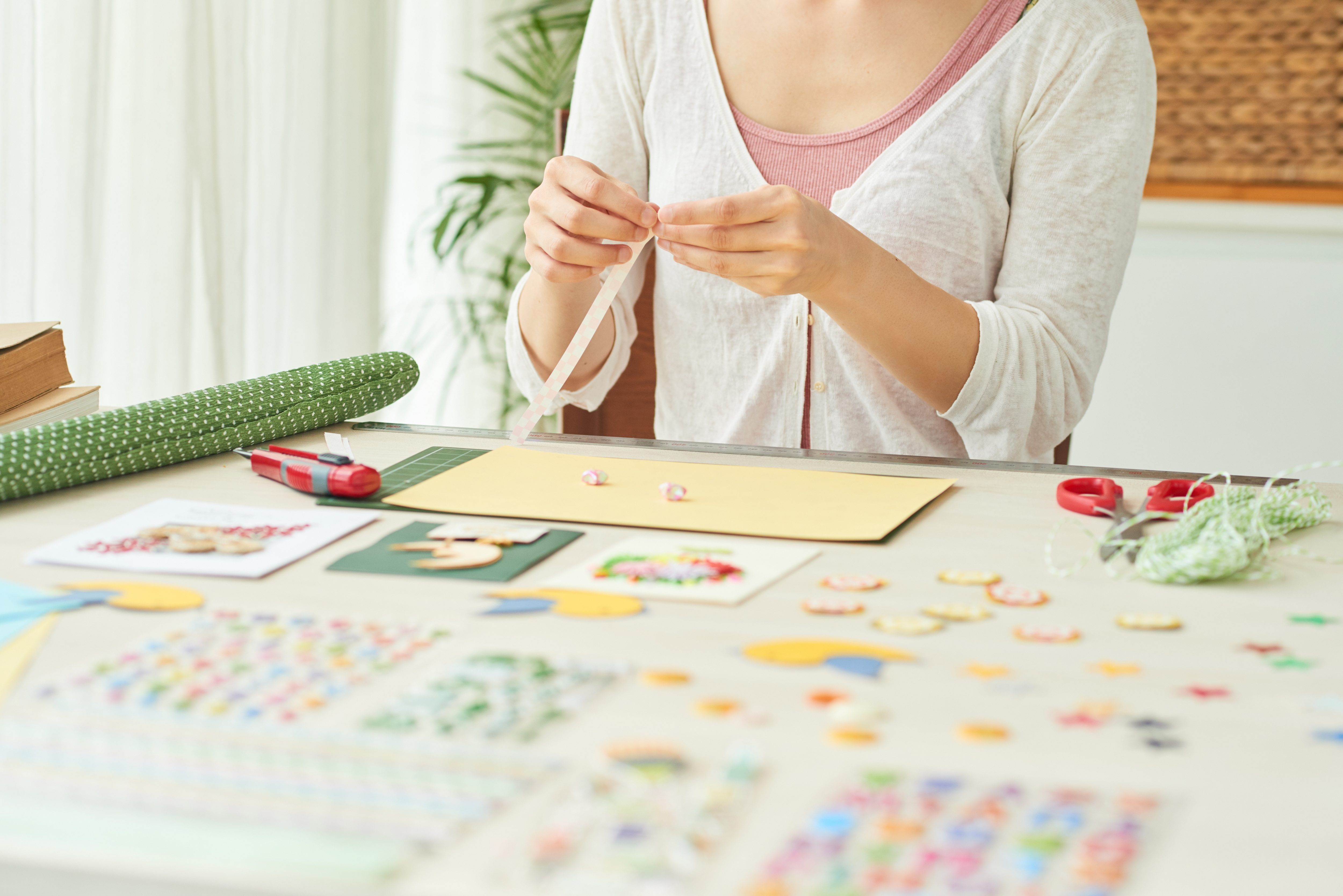 A creative woman puts together an Easter scrapbook full of family memories.