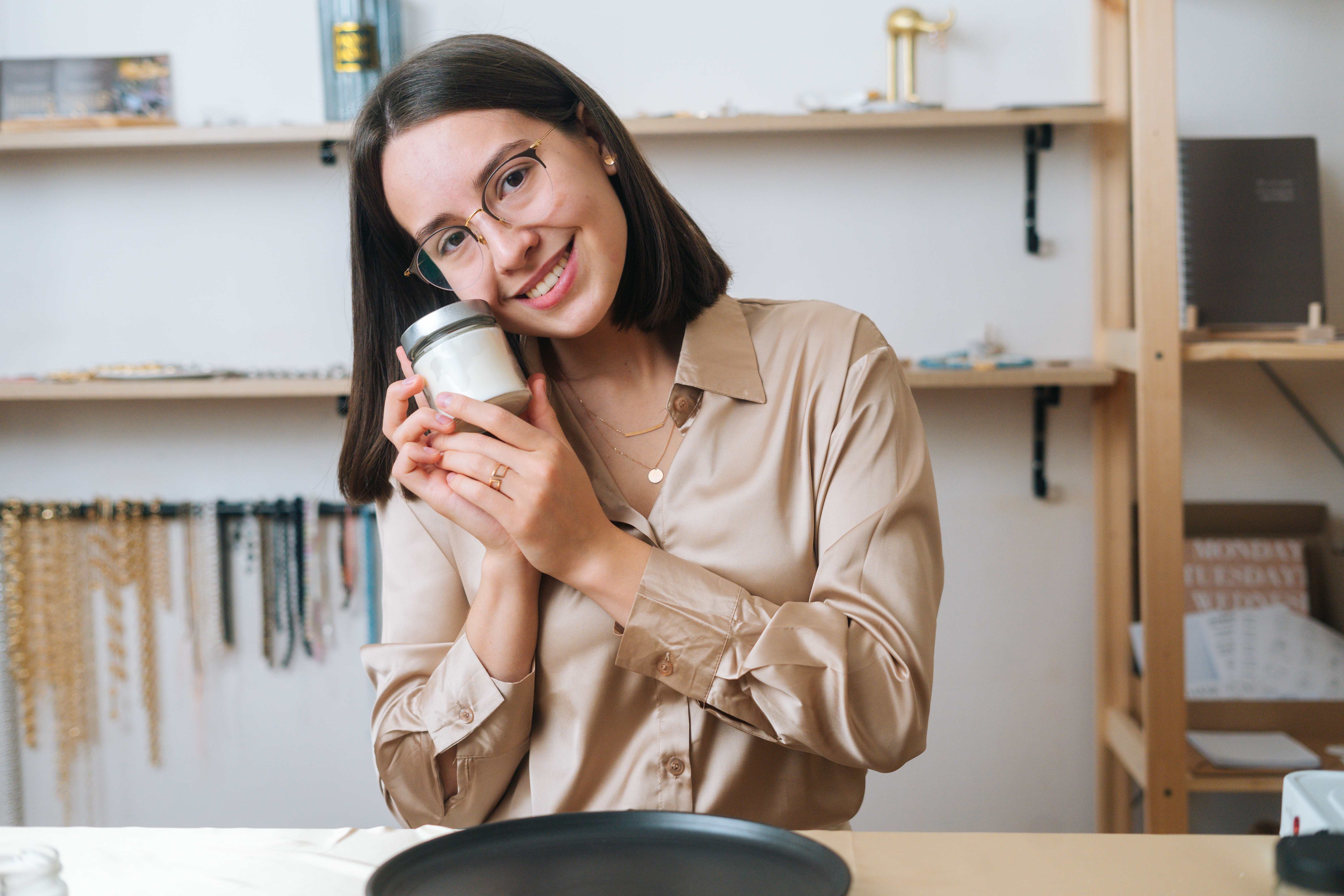 A woman receives a seasonal scented candle for spring.