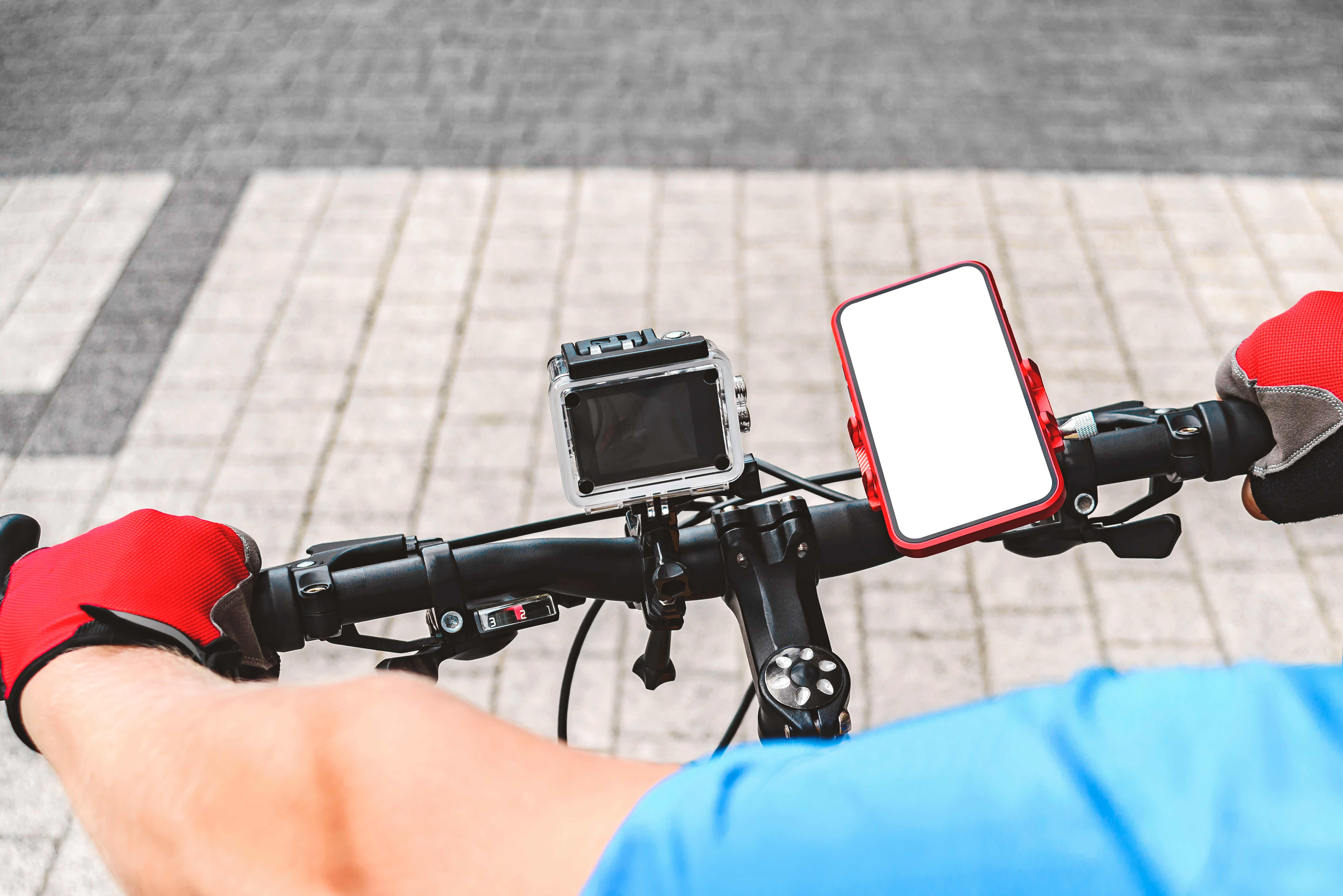 A mini action camera captures an adventurous man’s bike ride.