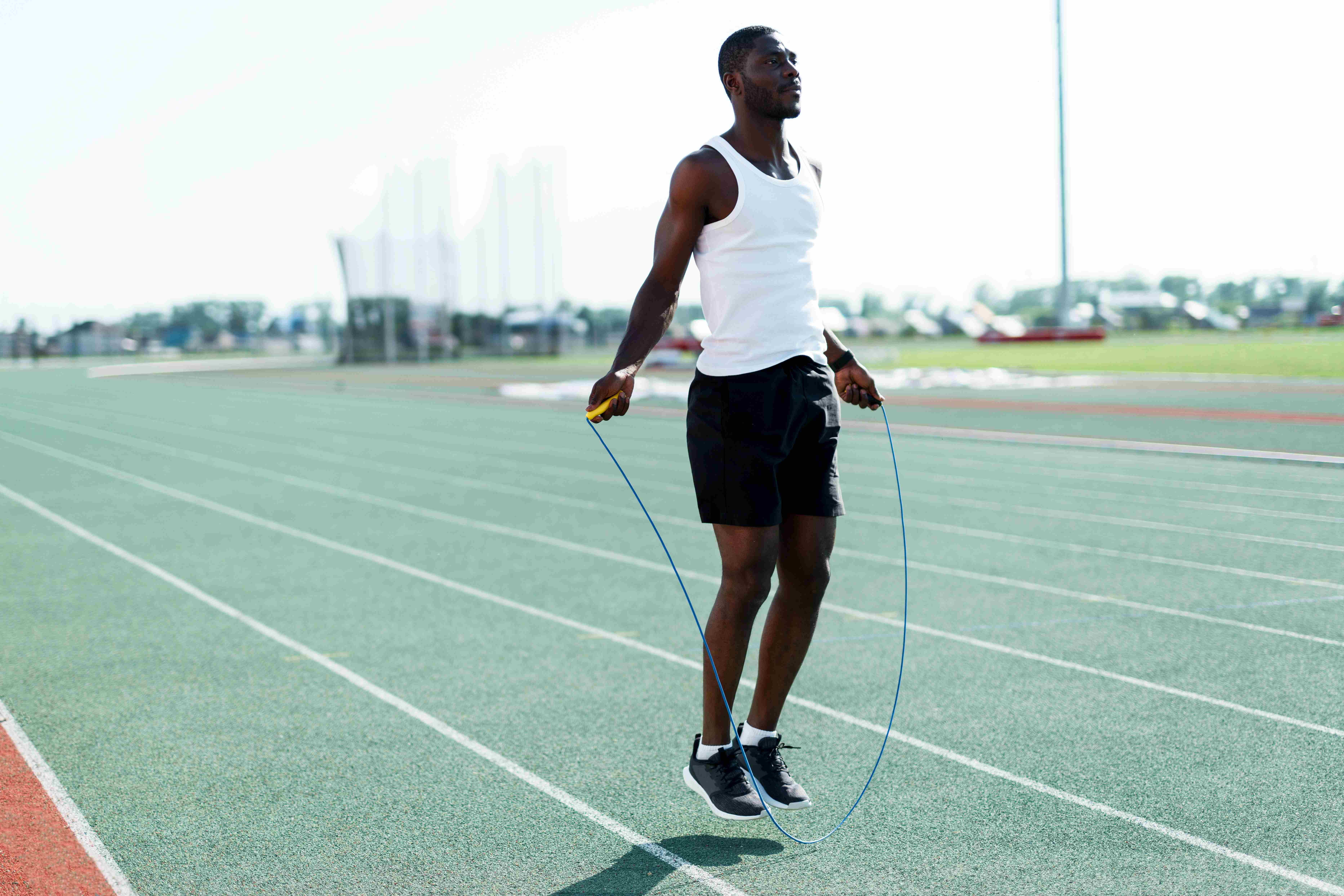 A healthy man uses a jump rope to make fitness more fun.