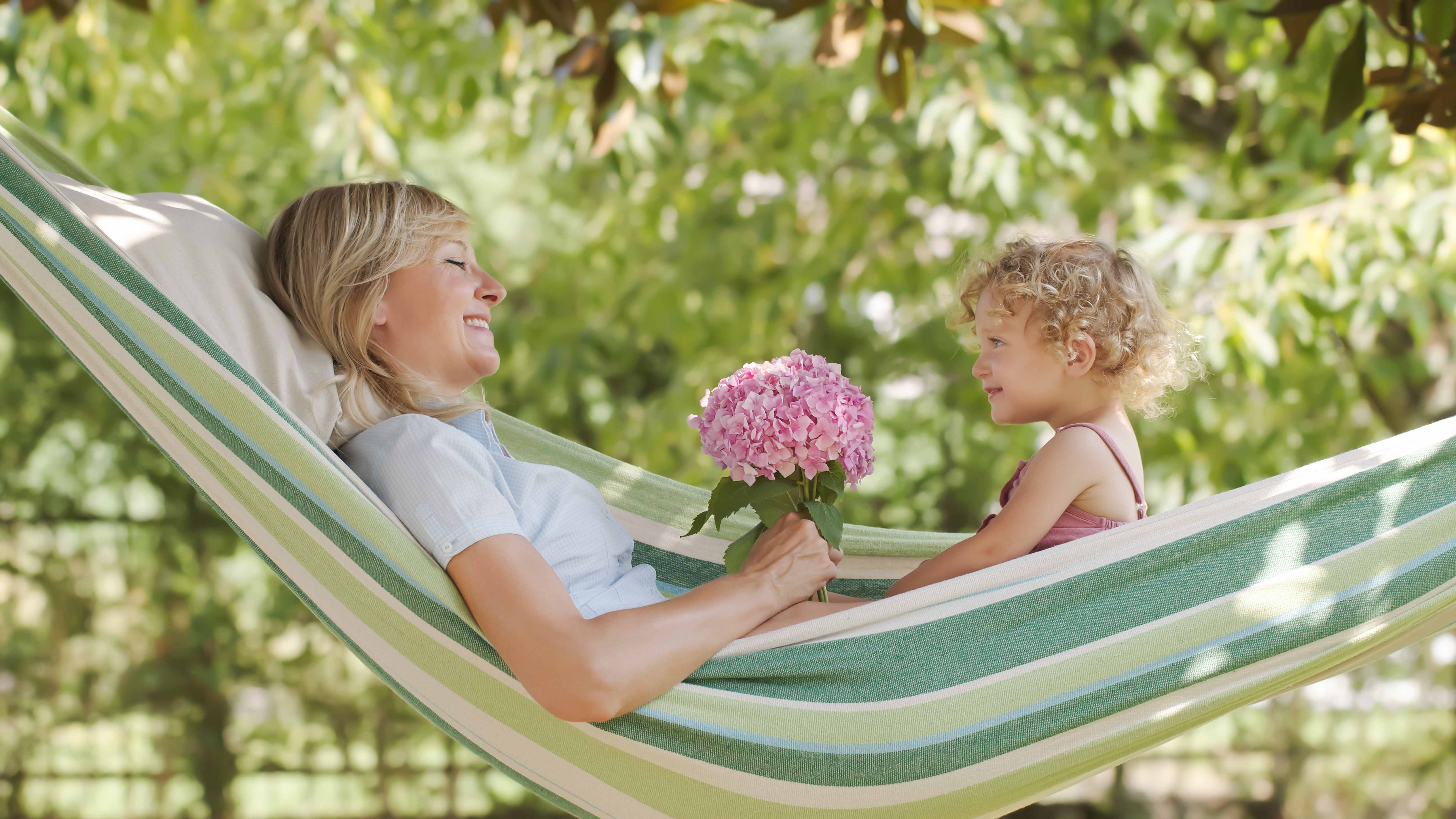 A new mom receives flowers from her baby daughter on Mother’s Day.