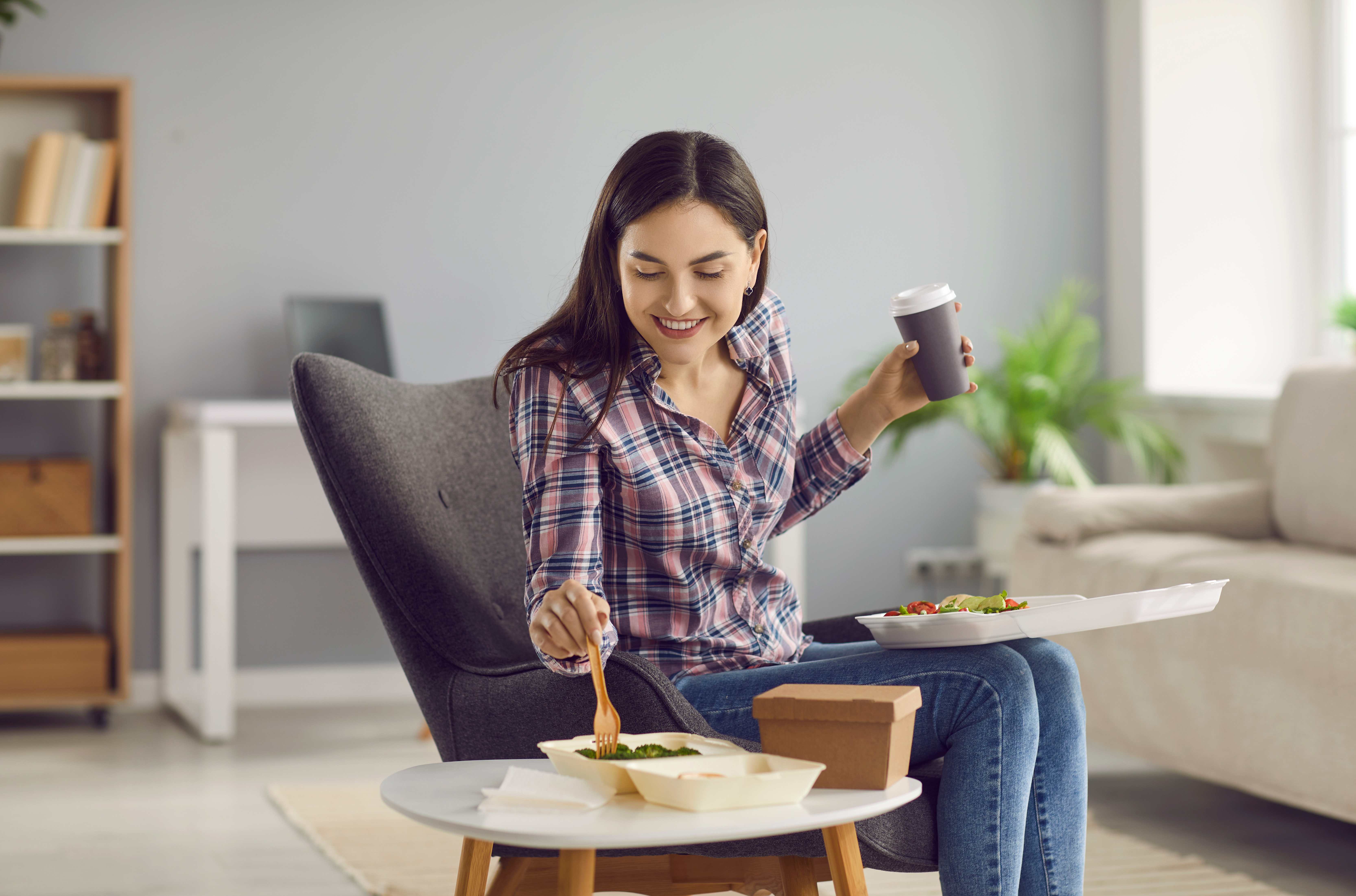 A hardworking new mom is excited to enjoy her takeout delivery.