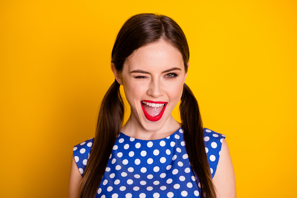 A beauty lover wears red lipstick to celebrate a special occasion.