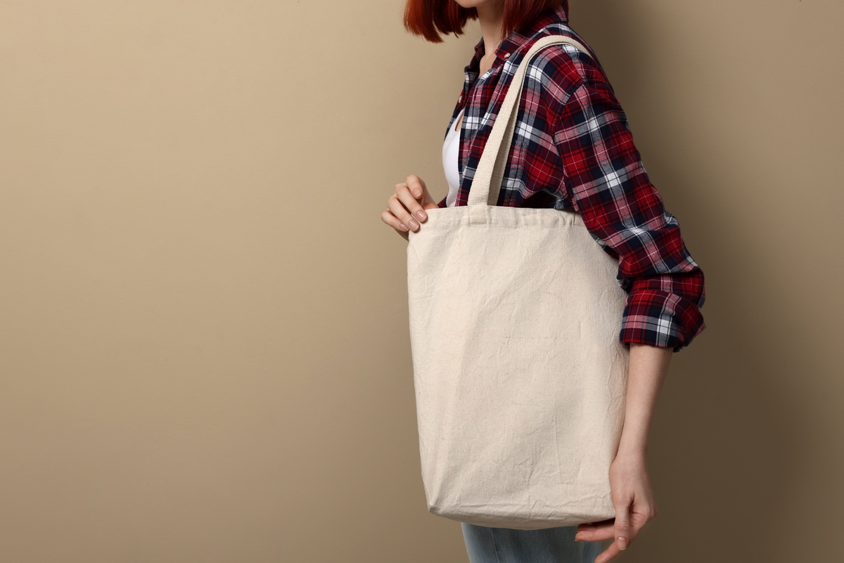 A first-time mom carries everything her baby needs in a large tote bag.