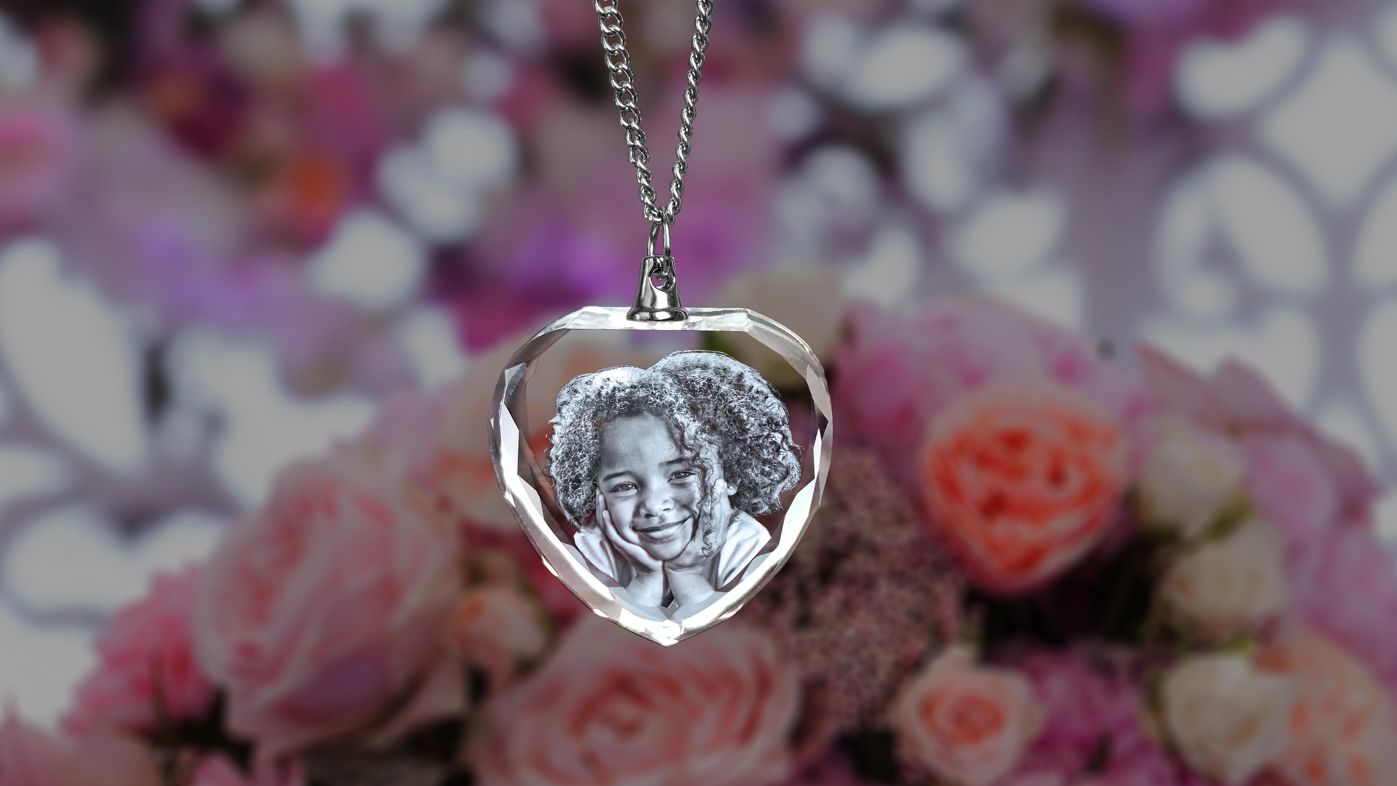 An engraved picture necklace for Mom shaped like a heart.