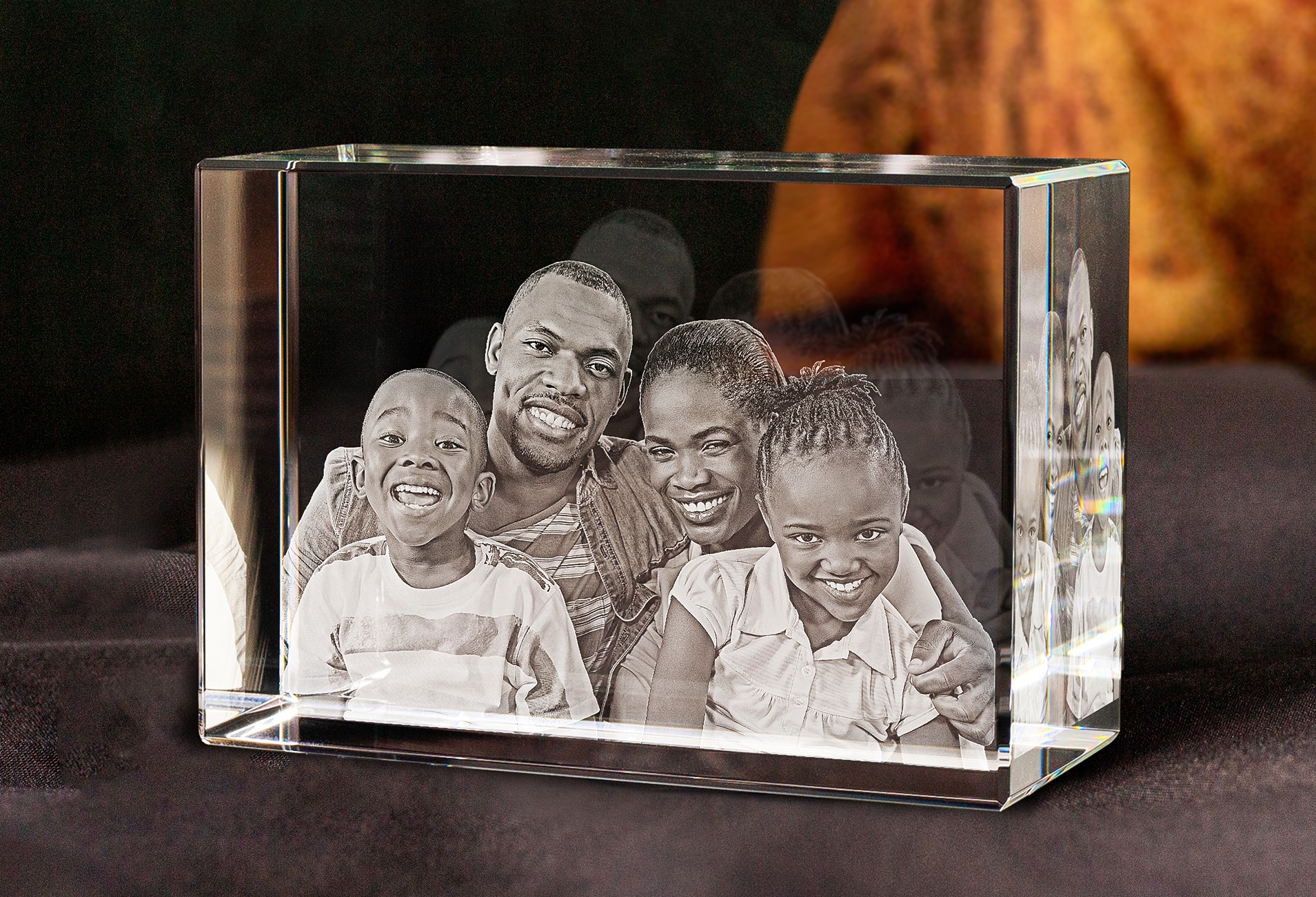 A 3D engraved crystal gift with a beautiful photo of a loving family inside.