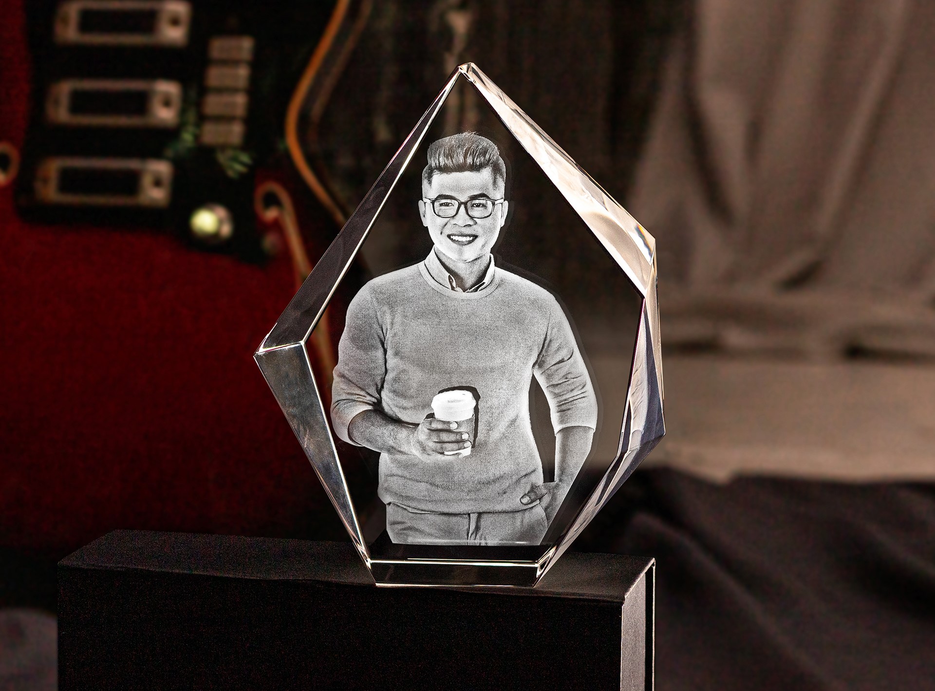 A unique crystal gift with a photo of a stylish young man engraved inside.