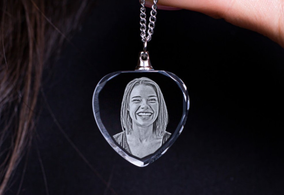 A woman shows off the personalized photo necklace she got as a birthday gift.