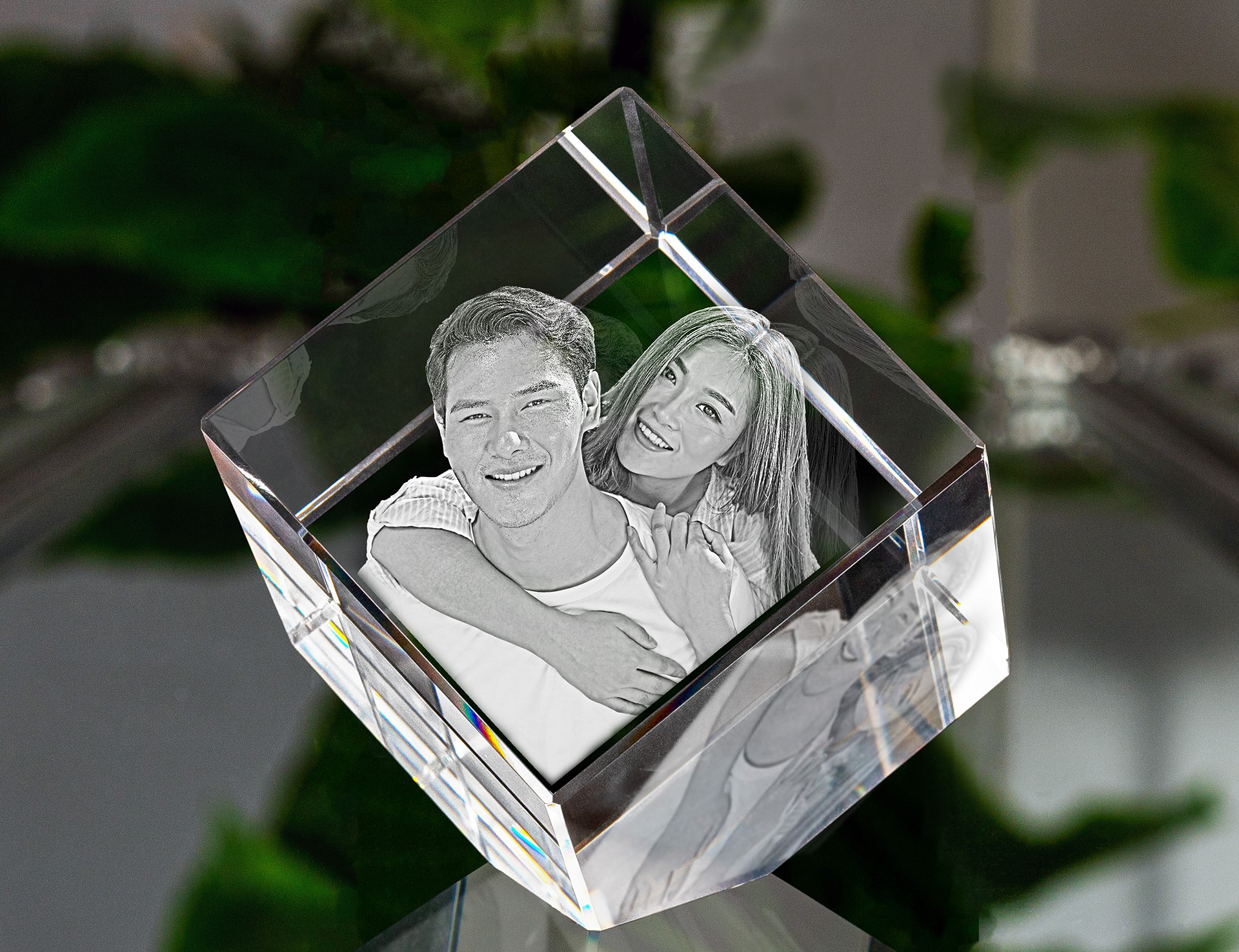 A beautiful photo of a brother and sister engraved in 3D inside a crystal.
