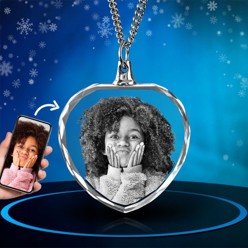 A photo of a smiling girl engraved inside a personalized picture necklace. Xmas.