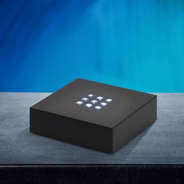 A Small Plastic Light Base with LEDs to display a 3D Photo Crystal