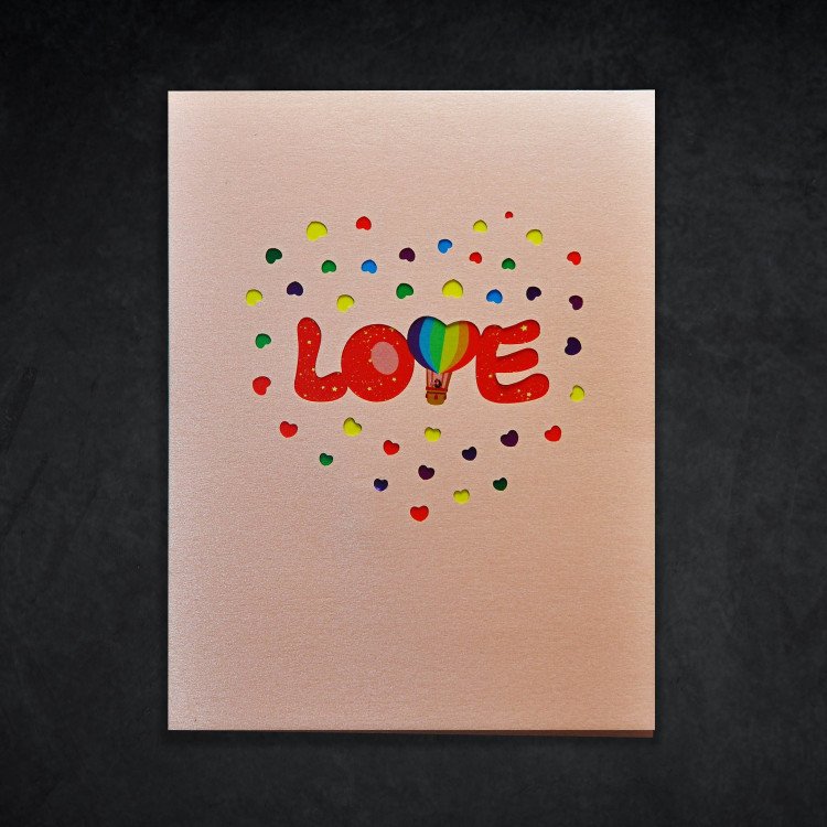 I Love You Greeting Card A closed greeting card that says “Love” in colorful letters on the front