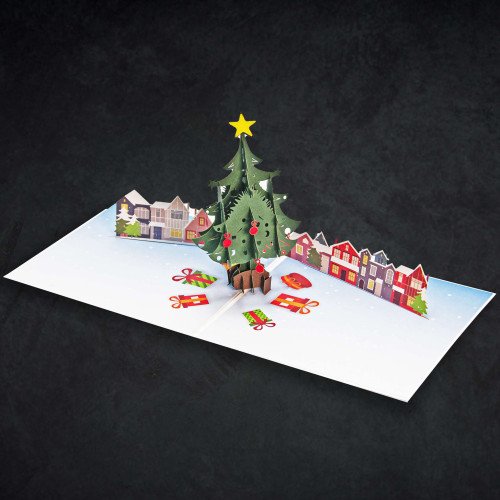 An open 3D Christmas Green Tree Card with a pop-up holiday scene inside