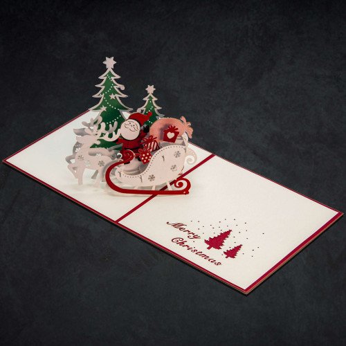 An open 3D Little Santa in the Sleigh Card with a pop-up holiday scene inside