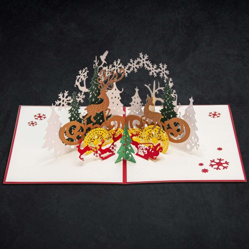 An open 3D Christmas Card with a festive pop-up display of reindeer inside